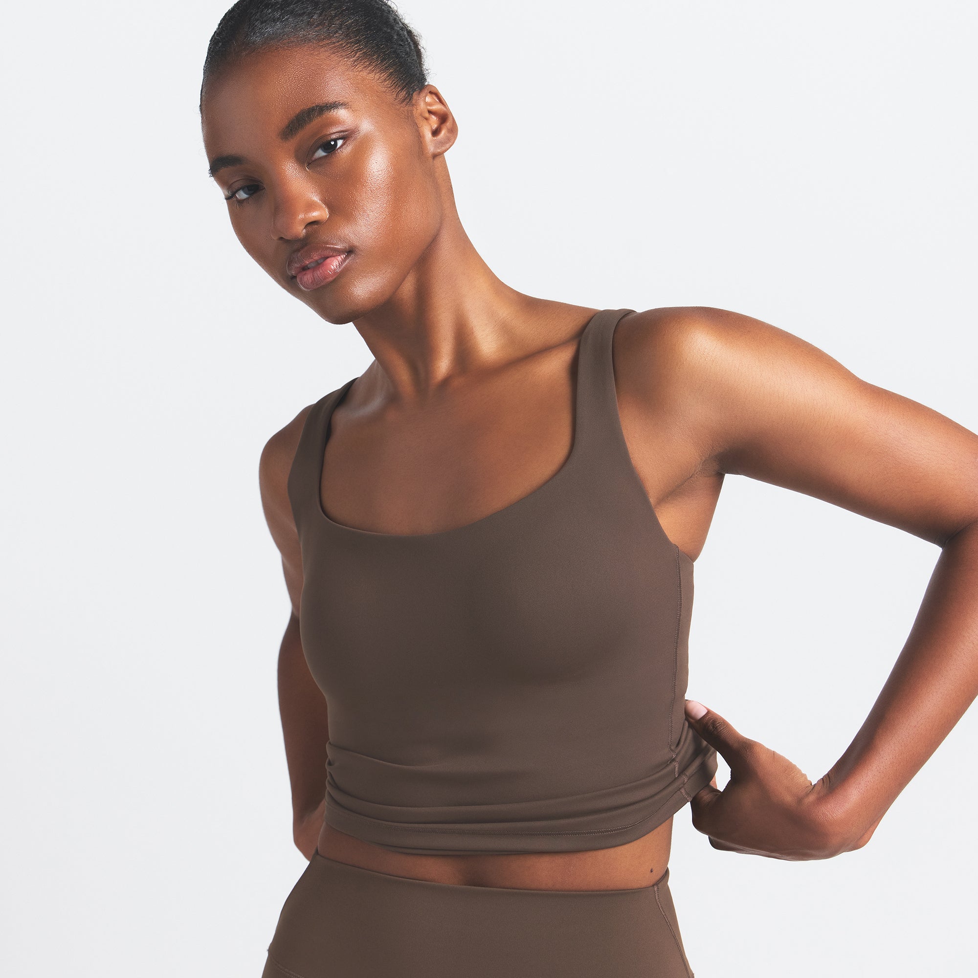 NikeSKIMS MATTE SQUARE NECK TANK | DARK SEPIA ON A MODEL FRONT VIEW