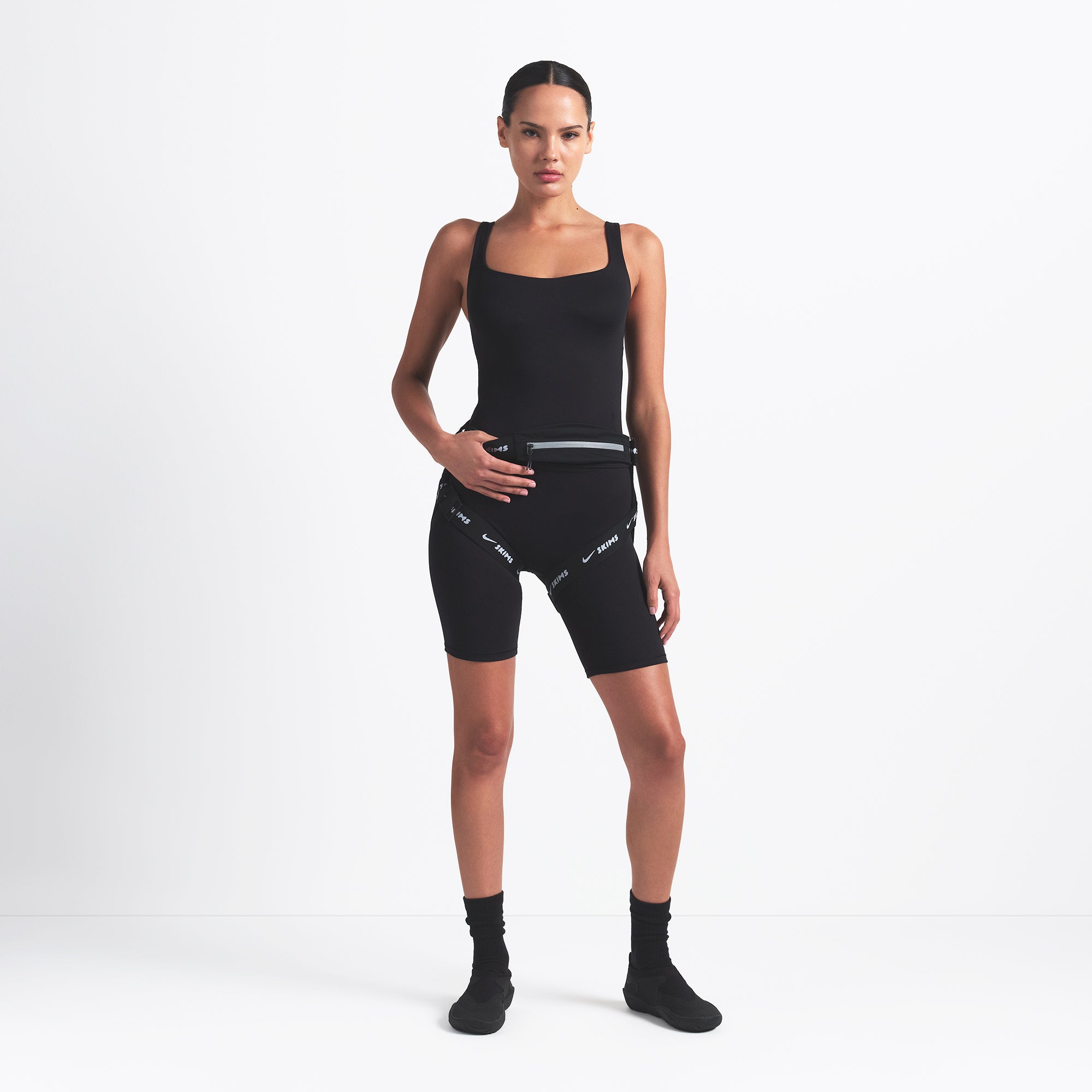 NikeSKIMS MATTE SQUARE NECK TANK | OBSIDIAN ON A MODEL FRONT VIEW @ | FOCUS: 0.0, 1.0, 0.9