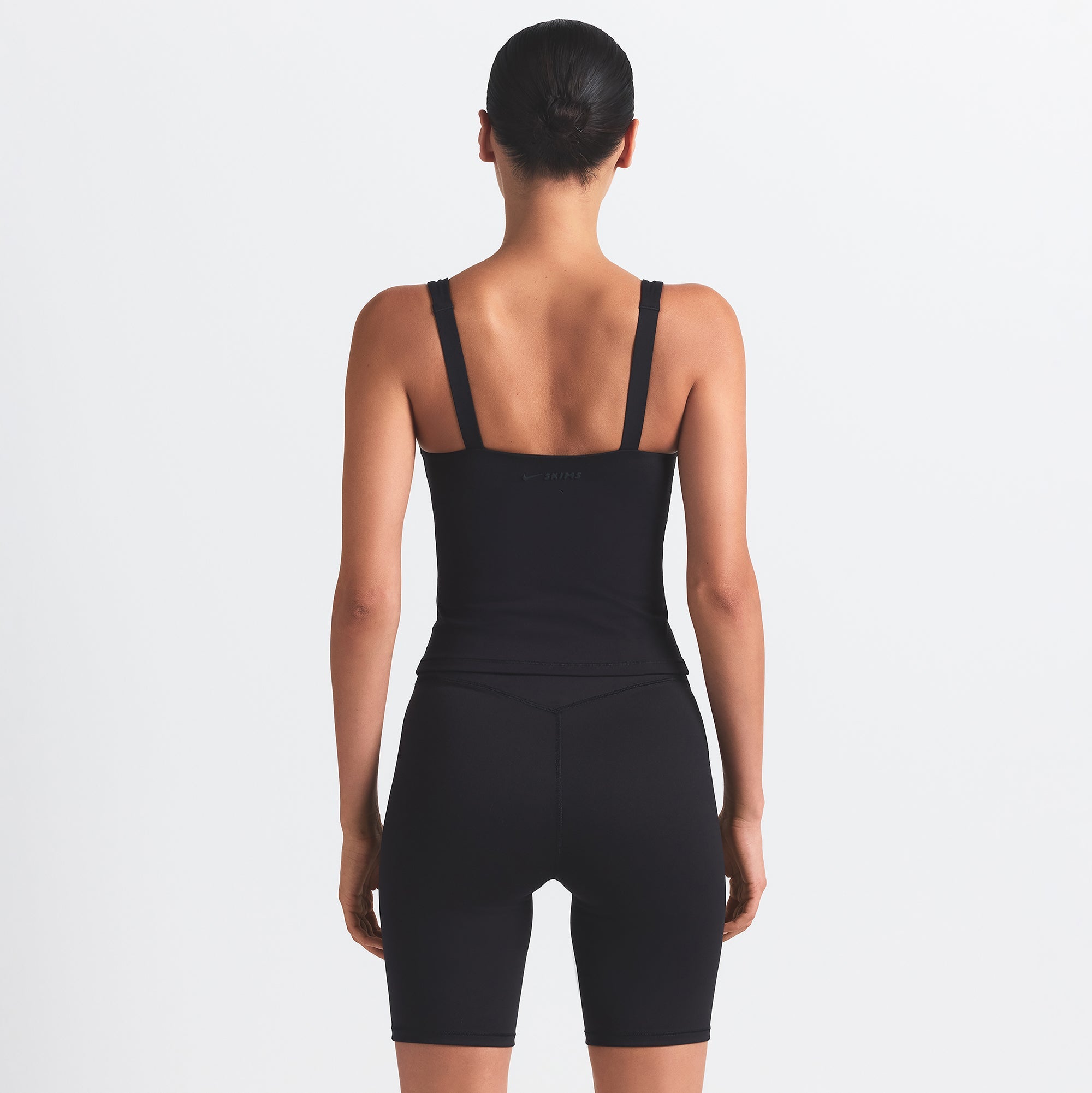NikeSKIMS MATTE SQUARE NECK TANK | OBSIDIAN ON A MODEL BACK VIEW @ | FOCUS: 0.0, 1.0, 0.9