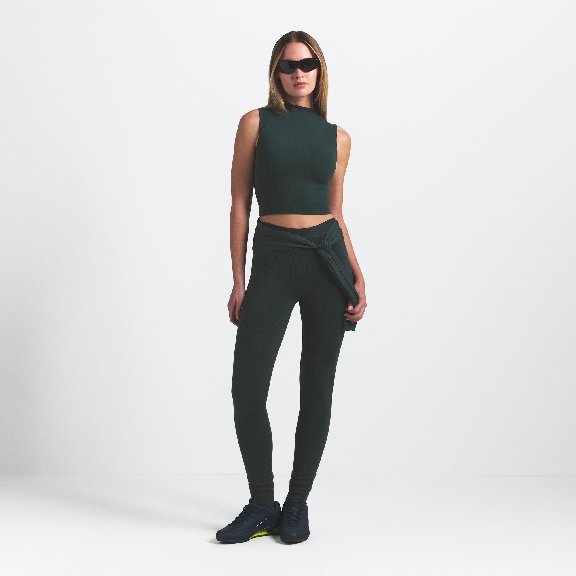 NikeSKIMS VINTAGE SEAMLESS MOCK NECK BRA TOP | DARK TEAL ON A MODEL FRONT VIEW @ | FOCUS: 0.0, 1.0, 0.9
