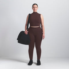 NikeSKIMS VINTAGE SEAMLESS MOCK NECK BRA TOP | PHOENIX ON A MODEL FRONT VIEW