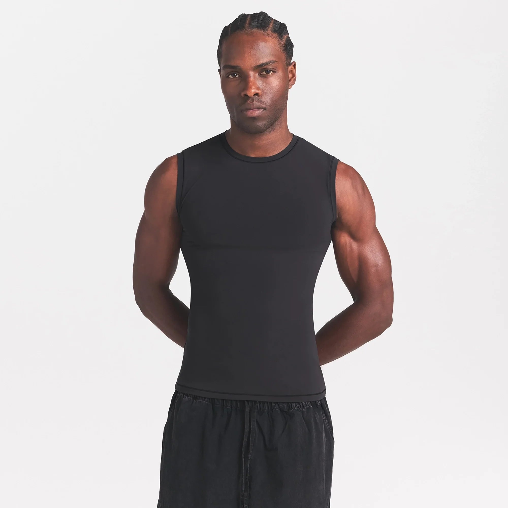 FITS EVERYBODY MENS SLIM TANK | ONYX ON A MODEL SIDE VIEW @ | FOCUS: 0.0, 1.0, 0.9