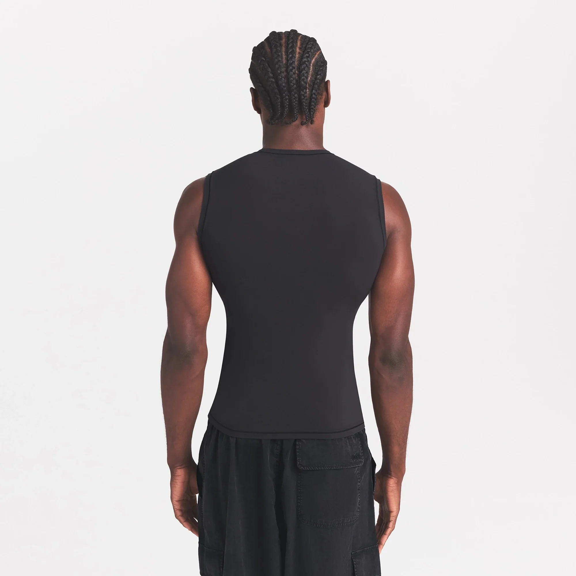 FITS EVERYBODY MENS SLIM TANK | ONYX ON A MODEL SIDE VIEW @ | FOCUS: 0.0, 1.0, 0.9