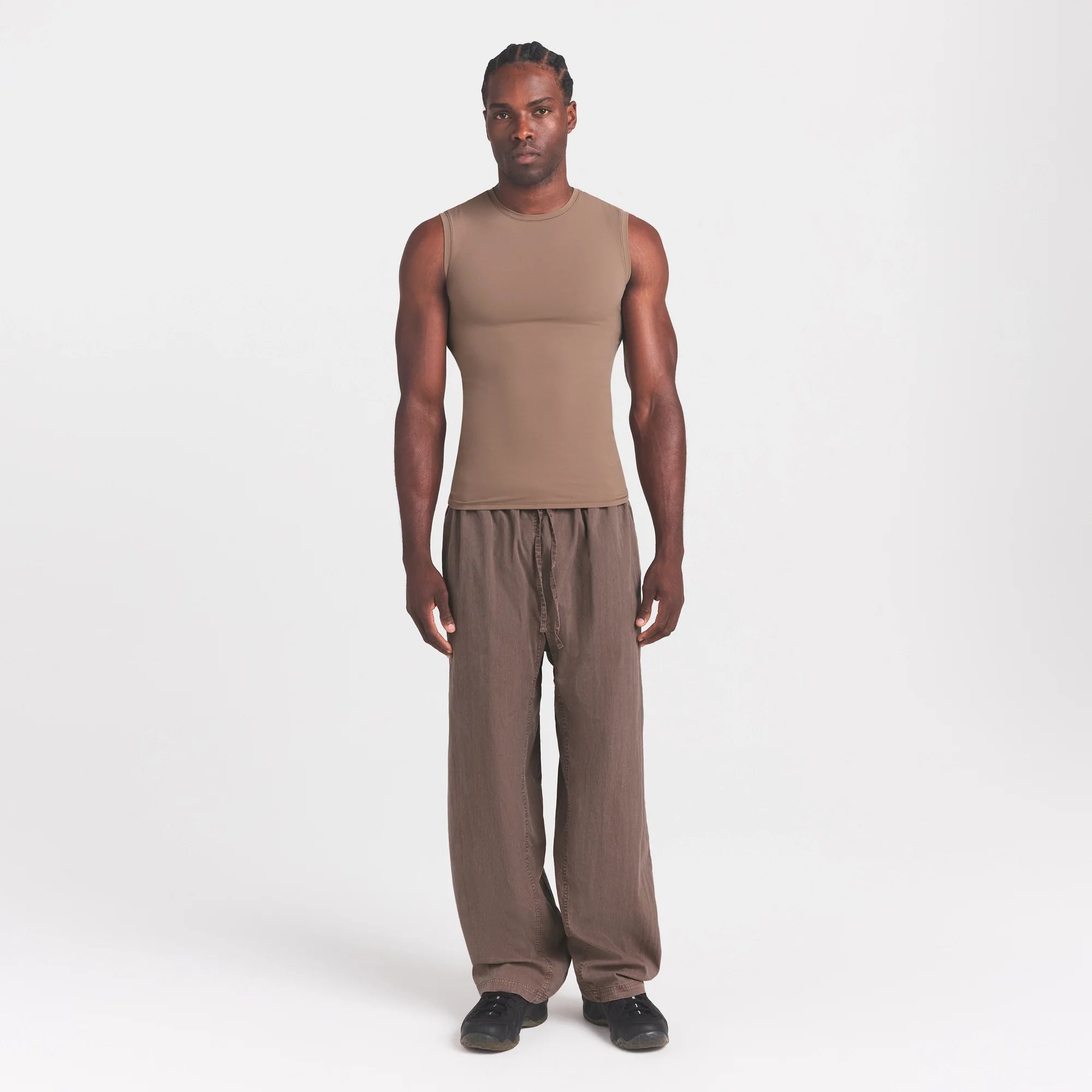 FITS EVERYBODY MENS SLIM TANK | UMBER ON A MODEL FRONT VIEW @ | FOCUS: 0.0, 1.0, 0.9