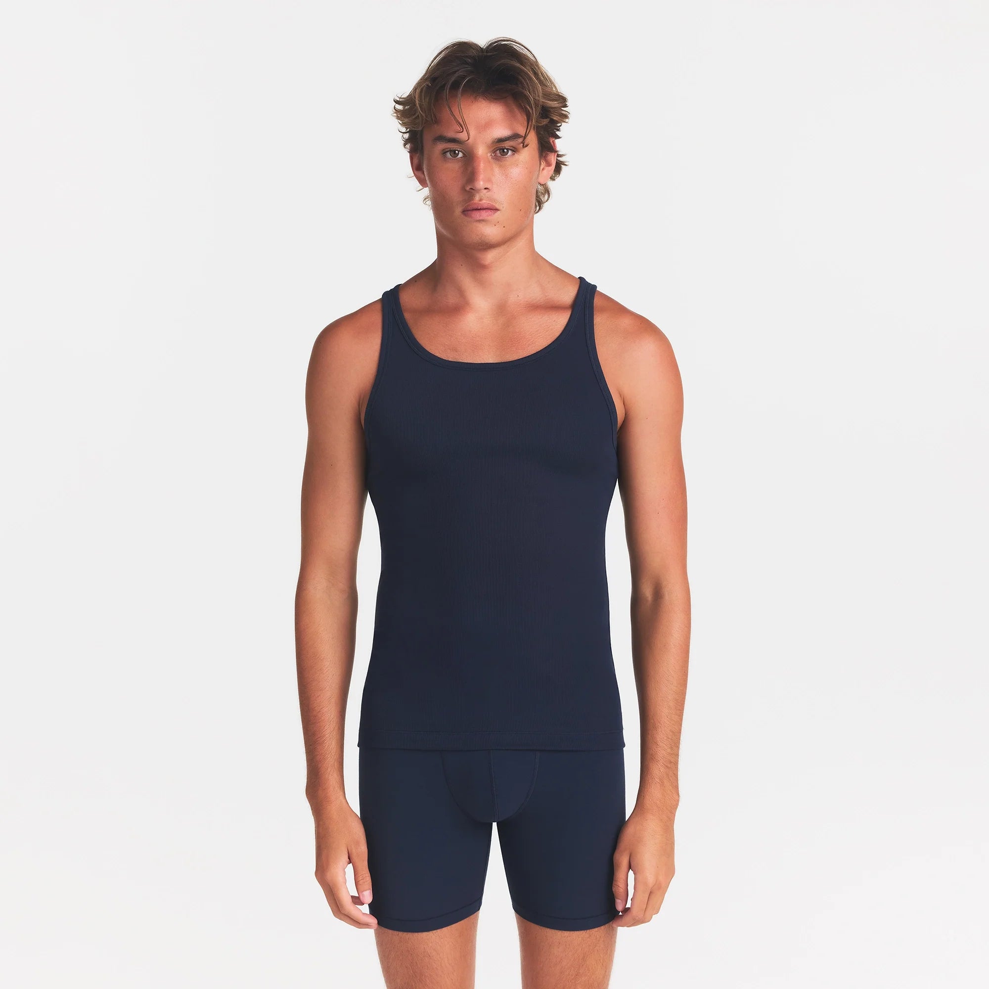 SKIMS COTTON MENS RIB TANK 3-PACK | ECRU MULTI ON A MODEL FRONT VIEW