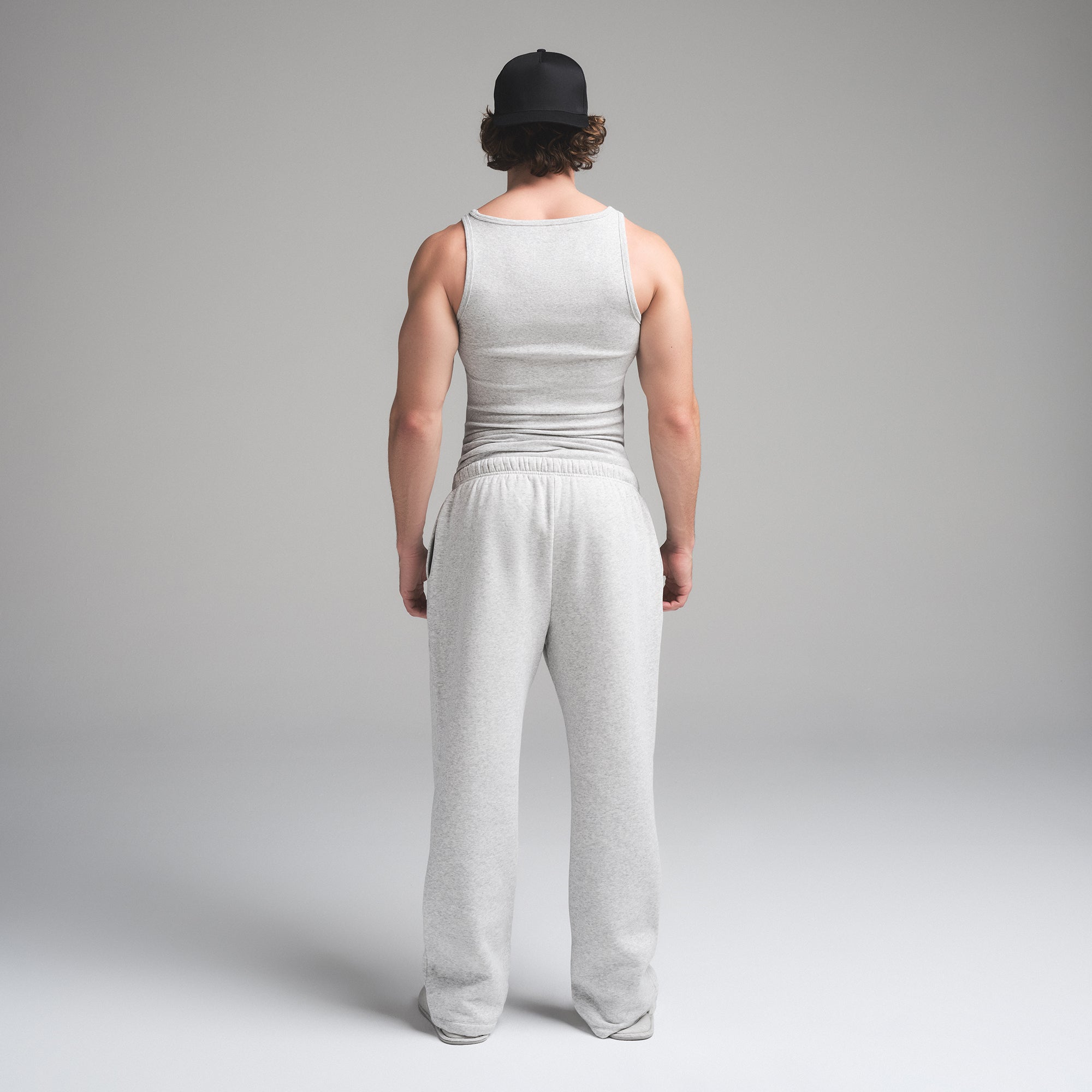 SKIMS COTTON MENS RIB TANK 3-PACK | HEATHER MULTI ON A MODEL SIDE VIEW | FOCUS: 0.0, 1.0, 0.9