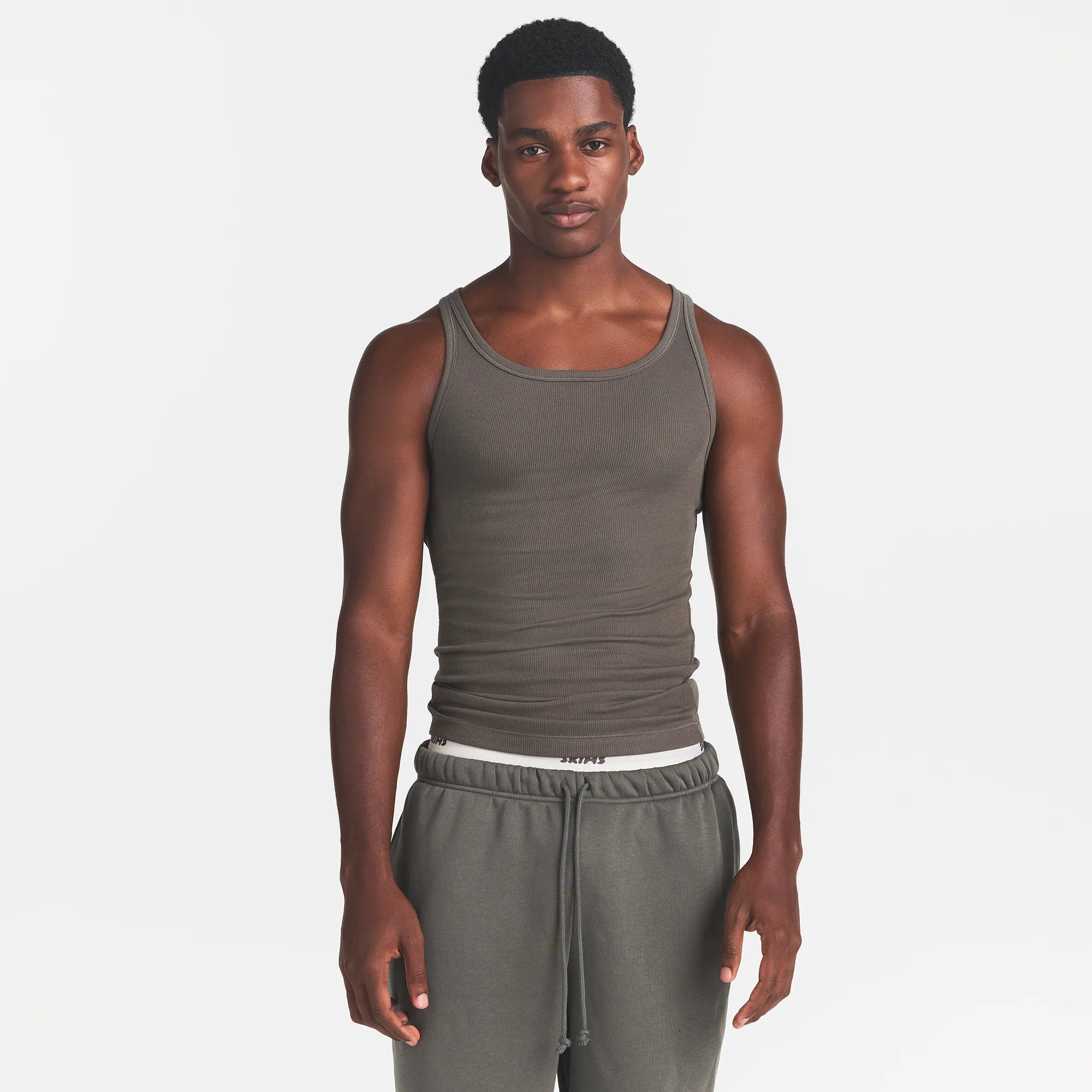 SKIMS COTTON MENS RIB TANK 3-PACK | JUNGLE MULTI ON A MODEL FRONT VIEW @ | FOCUS: 0.0, 1.0, 0.9