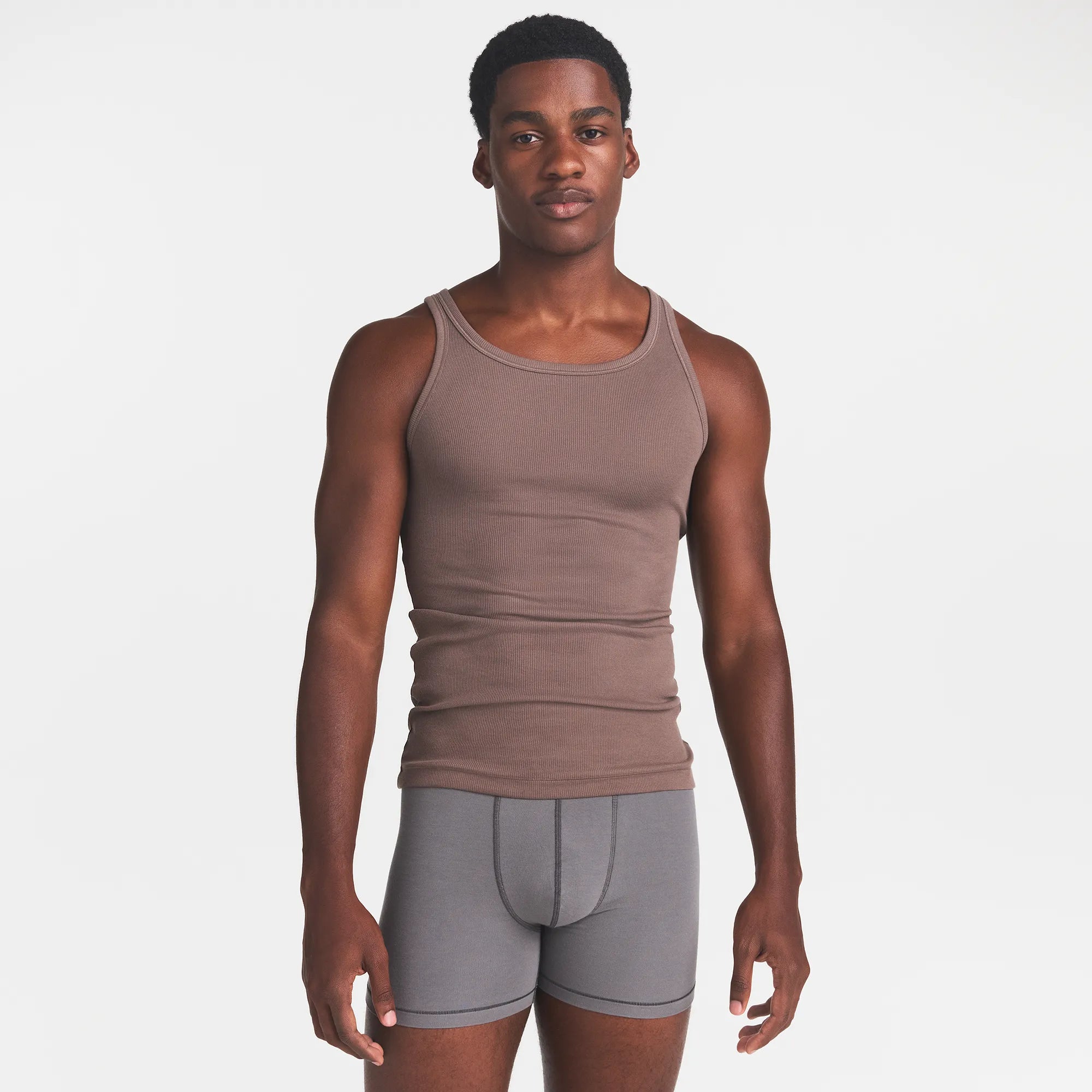 SKIMS COTTON MENS RIB TANK 3-PACK | JUNGLE MULTI ON A MODEL FRONT VIEW @ | FOCUS: 0.0, 1.0, 0.9