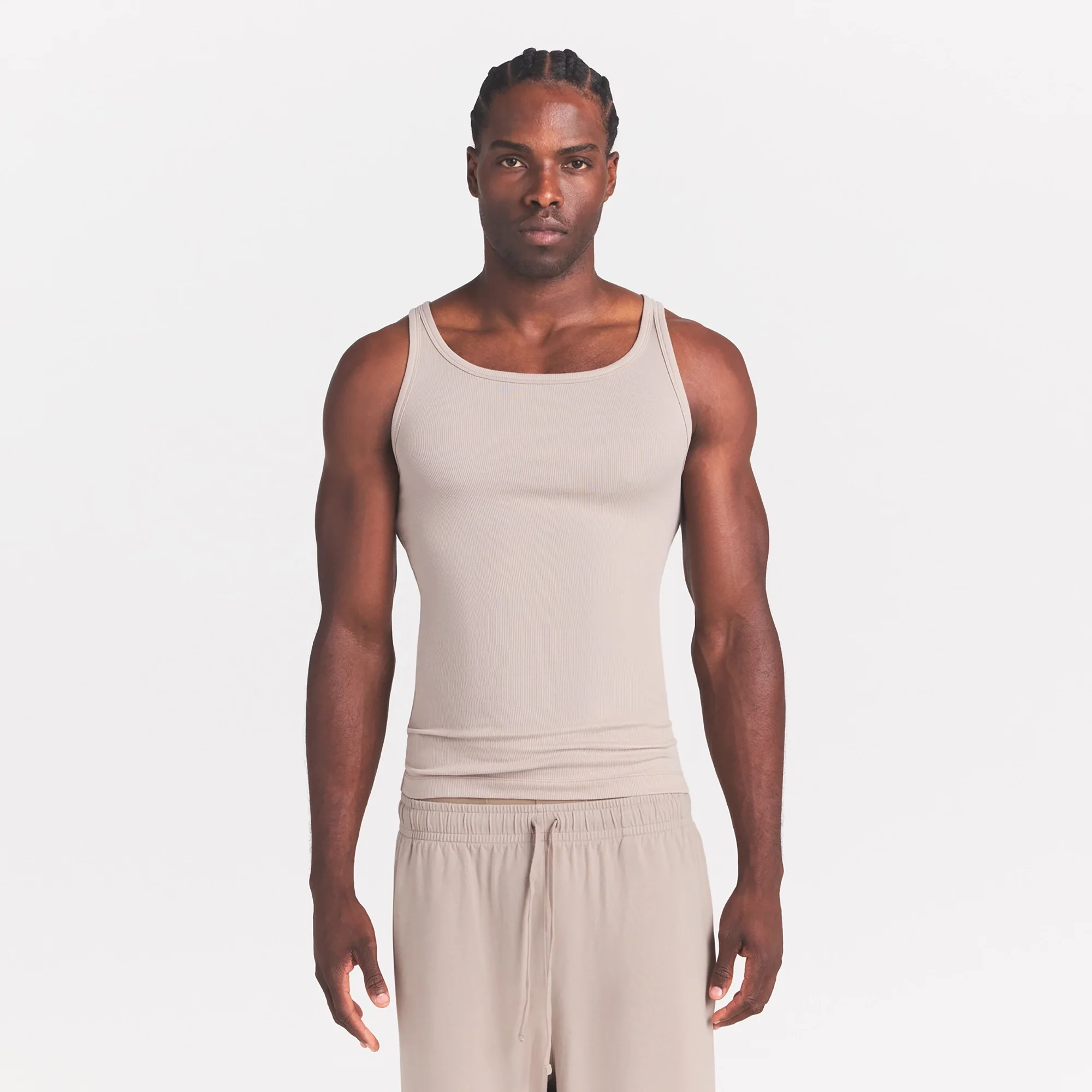SKIMS COTTON RIB MENS TANK 3-PACK | LINEN ECRU MULTI ON A MODEL SIDE VIEW @ | FOCUS: 0.0, 1.0, 0.9