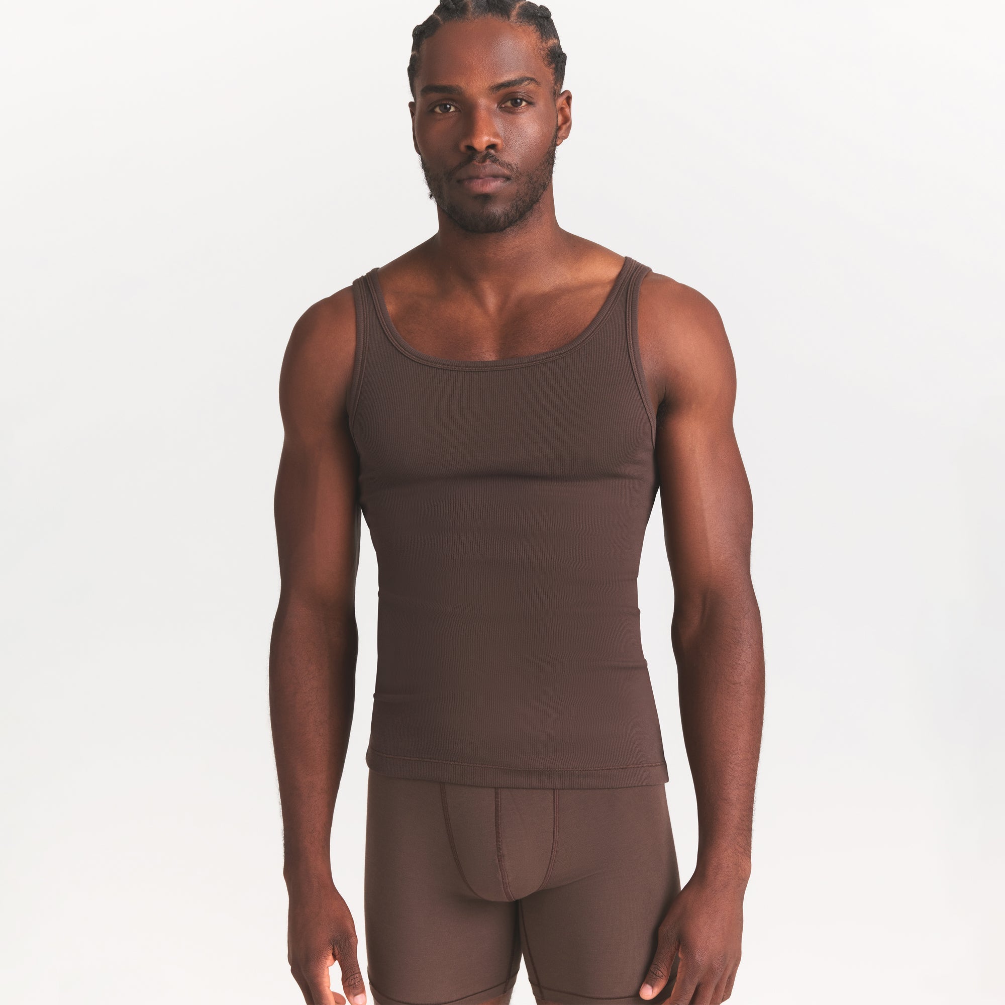 SKIMS COTTON MENS RIB TANK 3-PACK | VERDANT DARK SEPIA MULTI ON A MODEL SIDE VIEW @ | FOCUS: 0.0, 1.0, 0.9