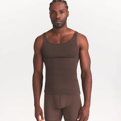 SKIMS COTTON MENS RIB TANK 3-PACK | VERDANT DARK SEPIA MULTI ON A MODEL SIDE VIEW @ | FOCUS: 0.0, 1.0, 0.9