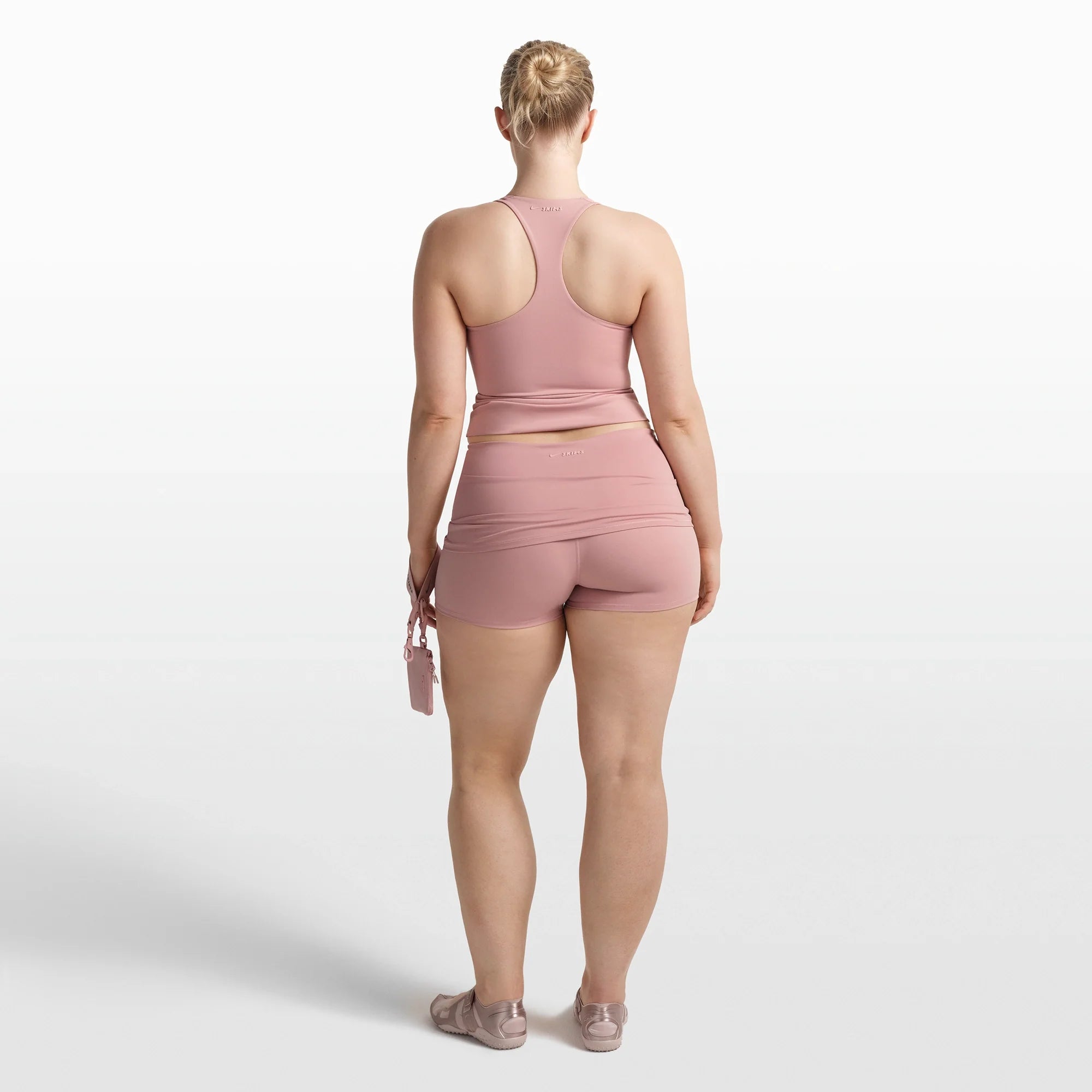 NikeSKIMS MATTE RACER BACK TANK | HIMALAYAN ON A MODEL FRONT VIEW @ | FOCUS: 0.0, 1.0, 0.9