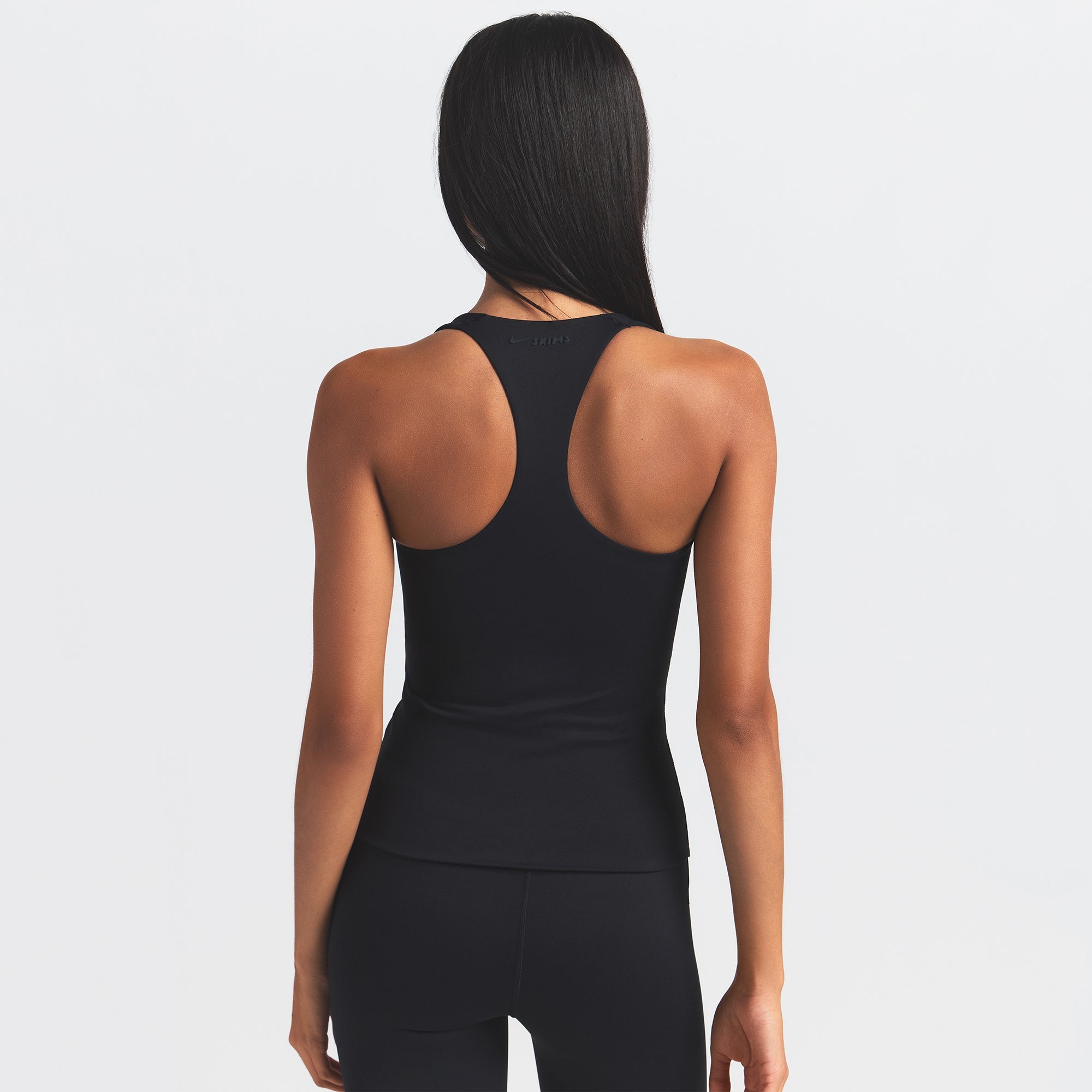 NikeSKIMS MATTE RACER BACK TANK | OBSIDIAN ON A MODEL BACK VIEW