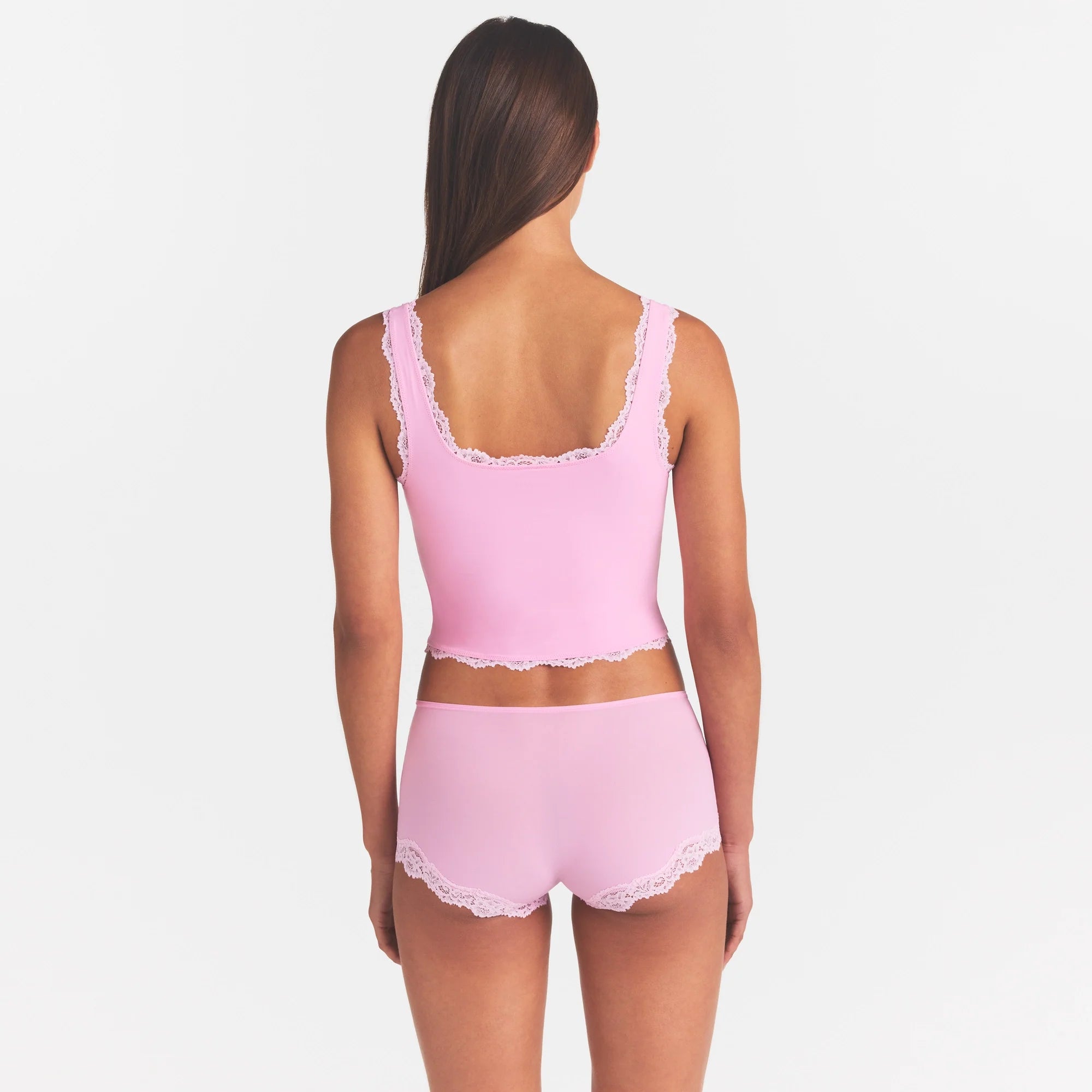 FITS EVERYBODY LACE TANK | BUBBLE GUM TONAL ON A MODEL SIDE VIEW @ | FOCUS: 0.0, 1.0, 0.9
