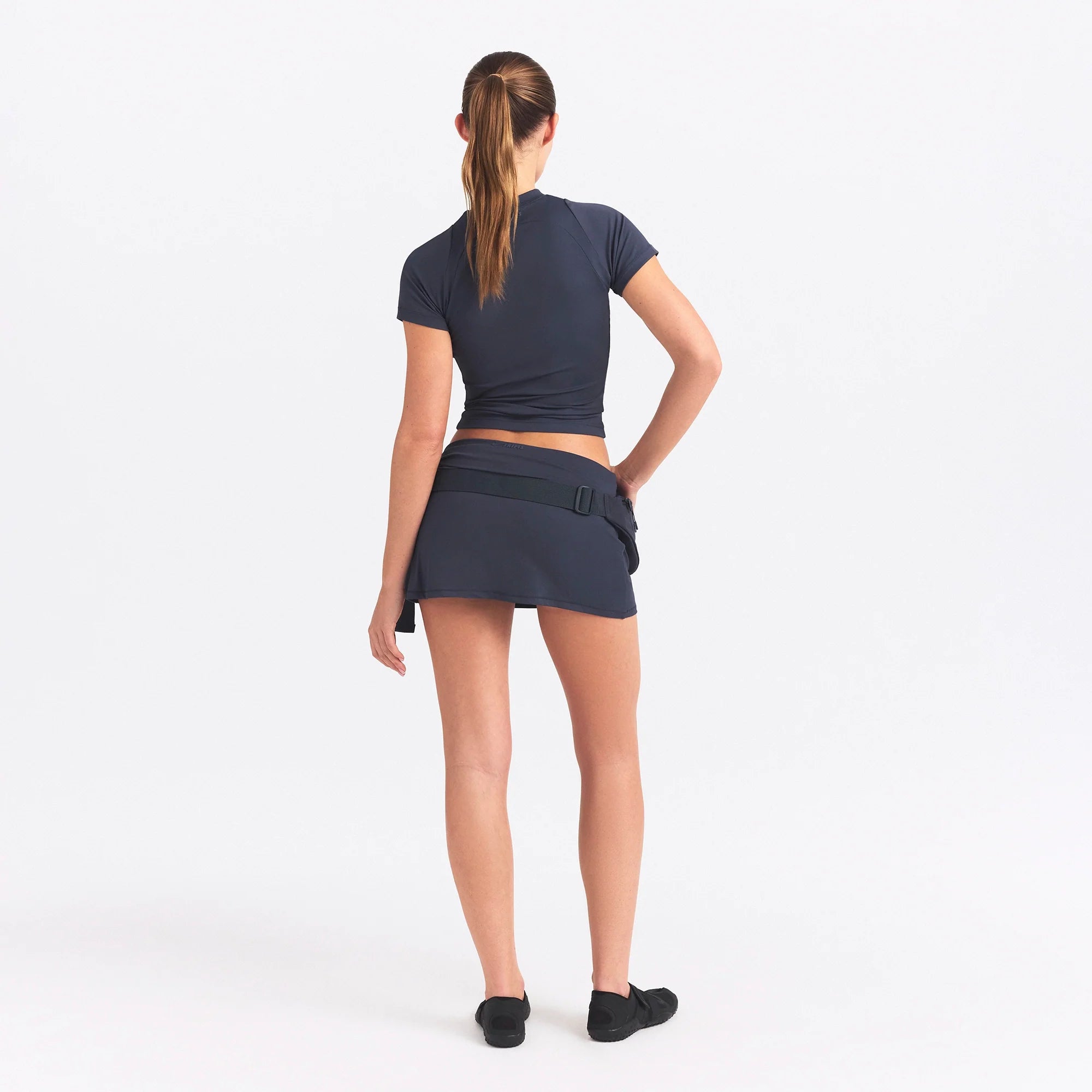 NikeSKIMS AIRY BABY TEE | DEEP ROYAL ON A MODEL SIDE VIEW @ | FOCUS: 0.0, 1.0, 0.9