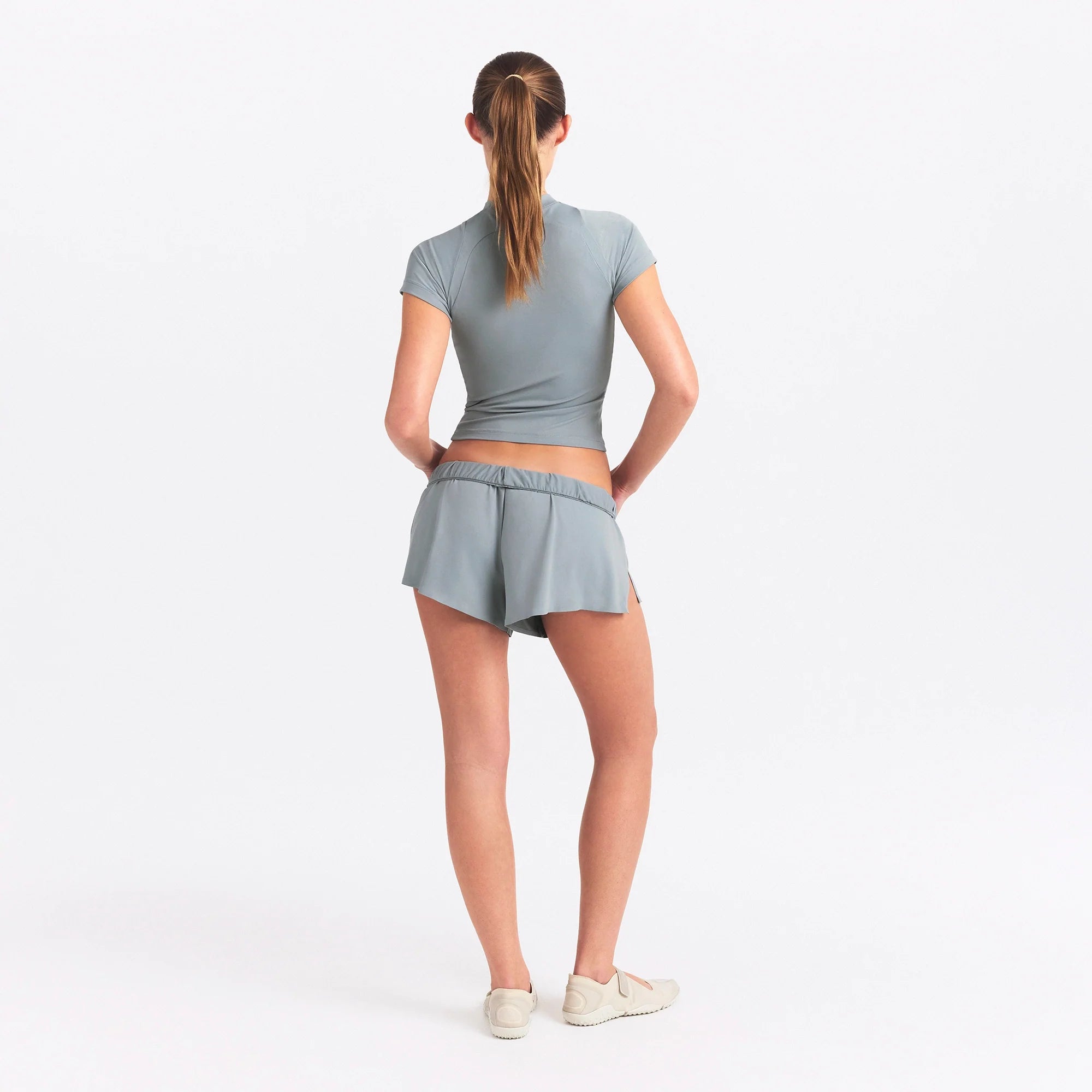 NikeSKIMS AIRY BABY TEE | WASHED PACIFIC ON A MODEL SIDE VIEW @ | FOCUS: 0.0, 1.0, 0.9