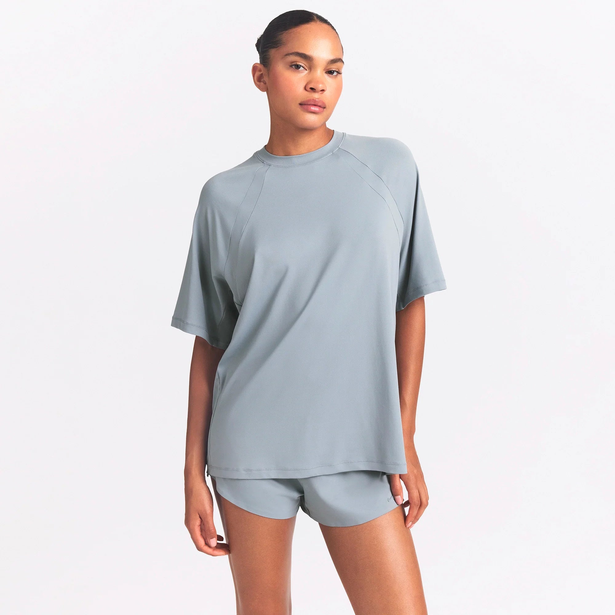 NikeSKIMS AIRY OVERSIZED TEE | WASHED PACIFIC ON A MODEL SIDE VIEW @ | FOCUS: 0.0, 1.0, 0.9