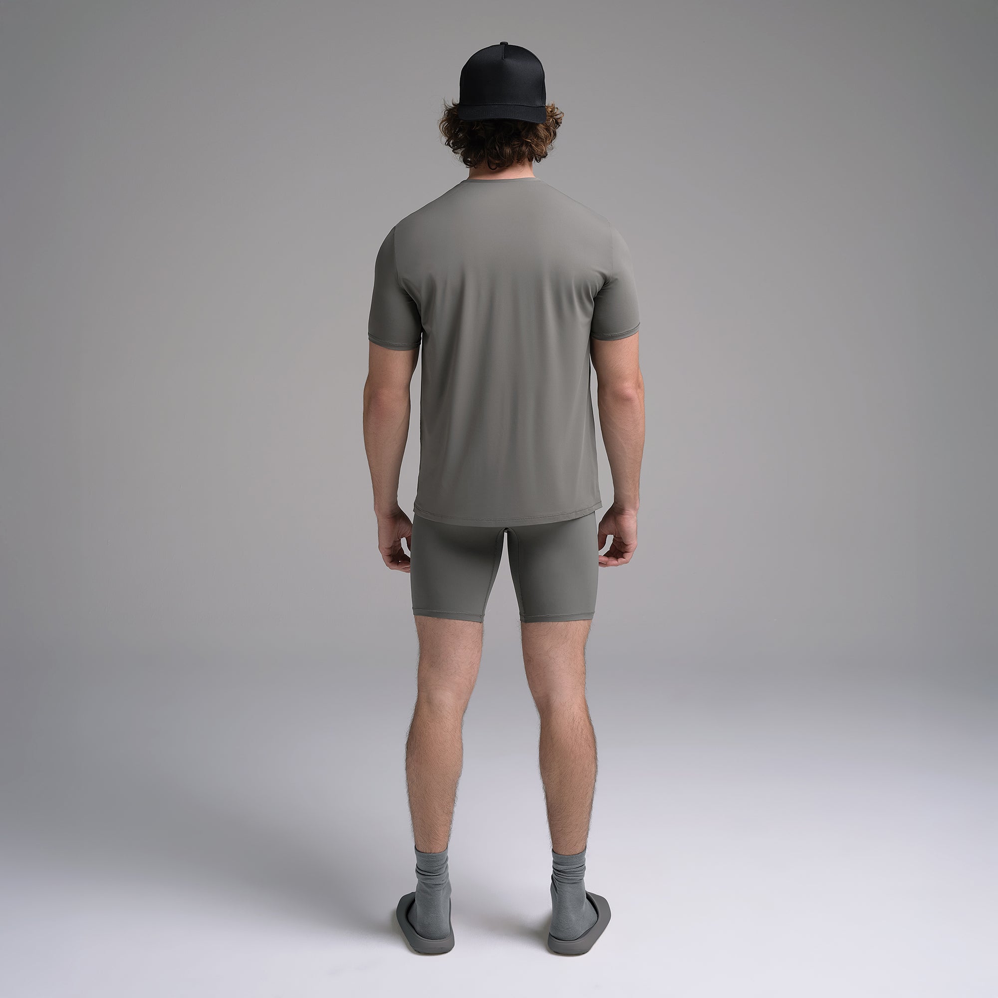 SKIMS SPORT MENS T-SHIRT | GUNMETAL ON A MODEL SIDE VIEW | FOCUS: 0.0, 1.0, 0.9