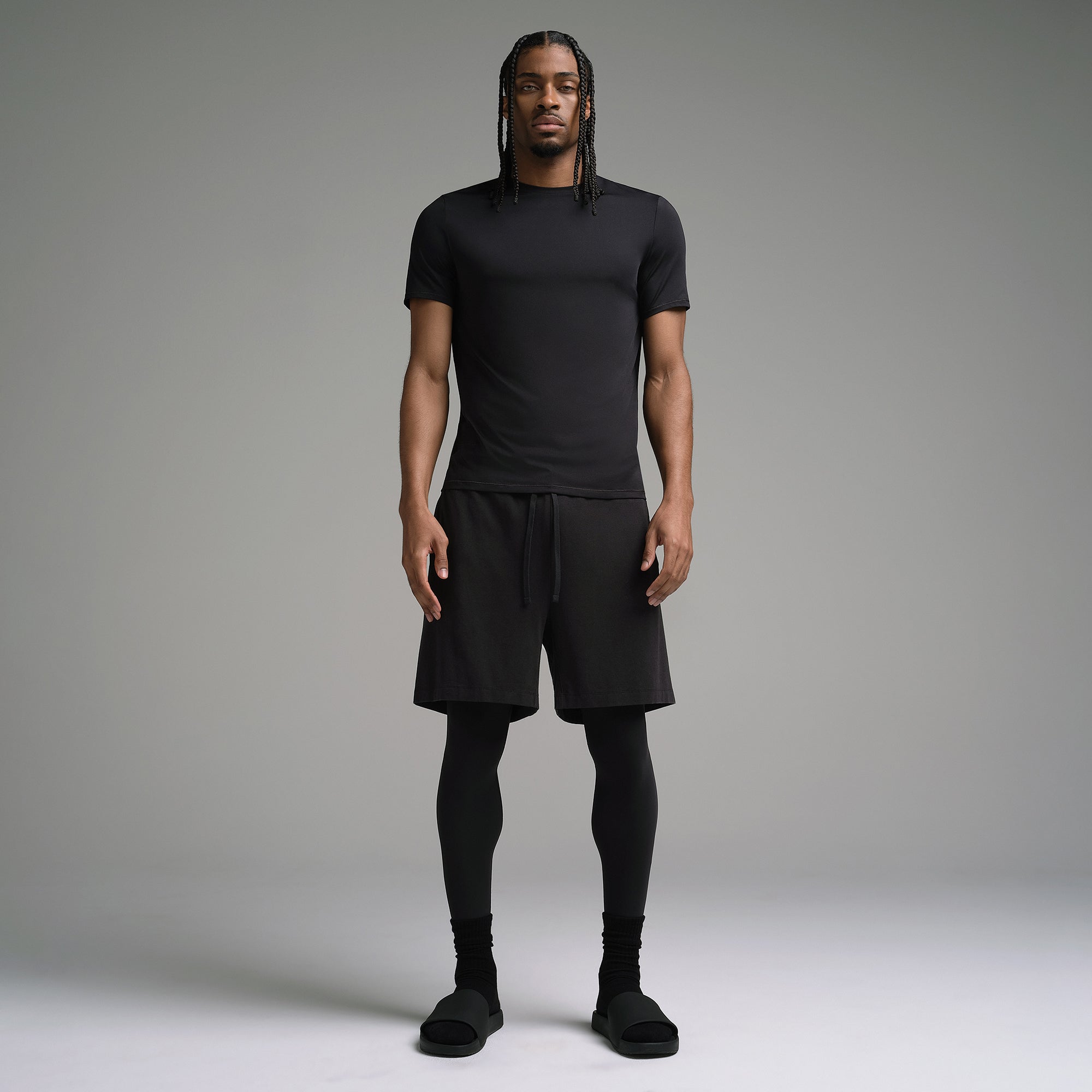 SKIMS SPORT MENS T-SHIRT | OBSIDIAN ON A MODEL FRONT VIEW | FOCUS: 0.0, 1.0, 0.9