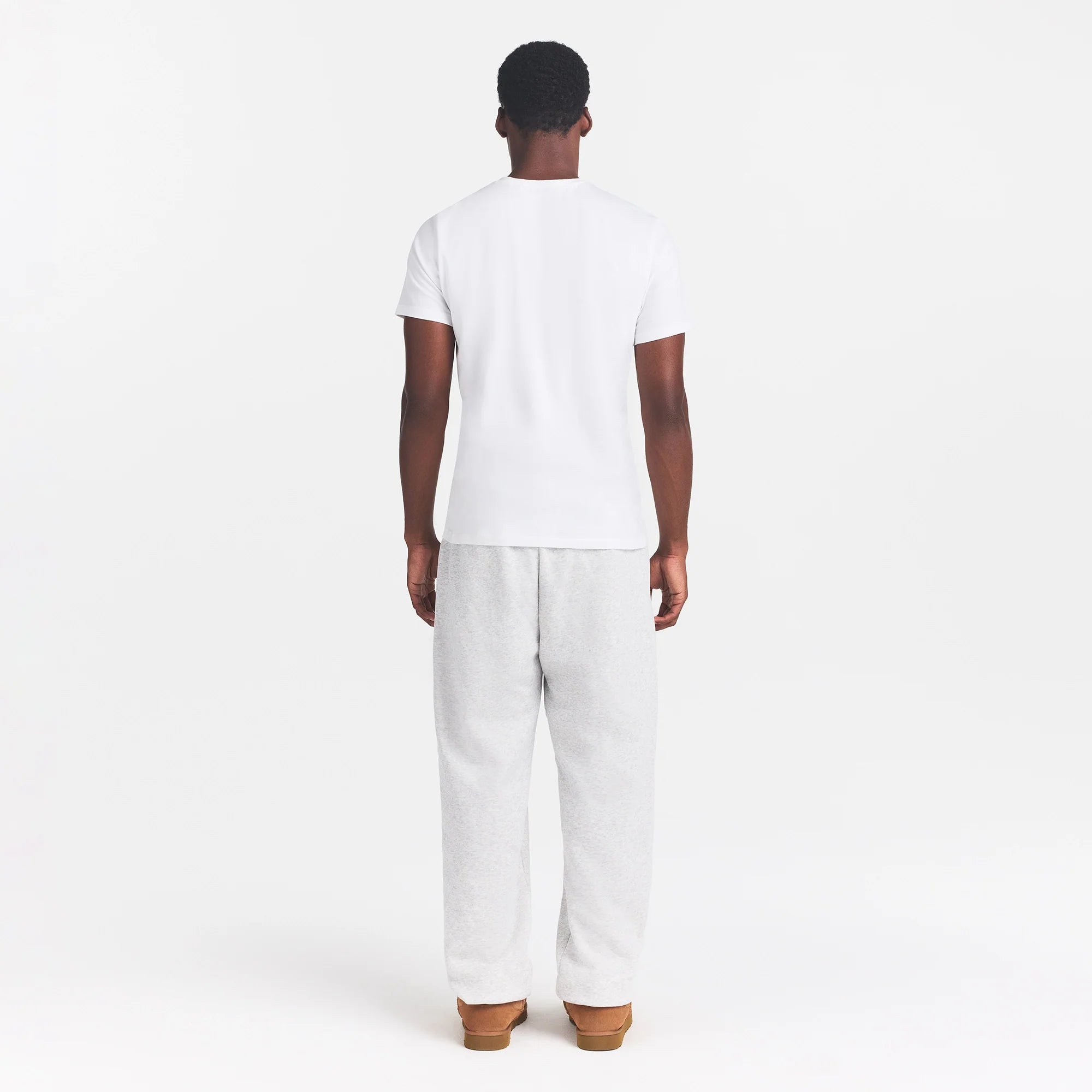 SKIMS COTTON MENS CLASSIC T-SHIRT | CHALK ON A MODEL BACK VIEW  @ | FOCUS: 0.0, 1.0, 0.9