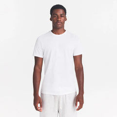 SKIMS COTTON MENS CLASSIC T-SHIRT | CHALK ON A MODEL FRONT VIEW  @ | FOCUS: 0.0, 1.0, 0.9
