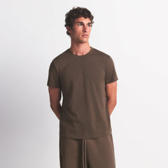 SKIMS COTTON MENS CLASSIC T-SHIRT | DRIFTWOOD ON A MODEL FRONT VIEW @ | FOCUS: 0.0, 1.0, 0.9