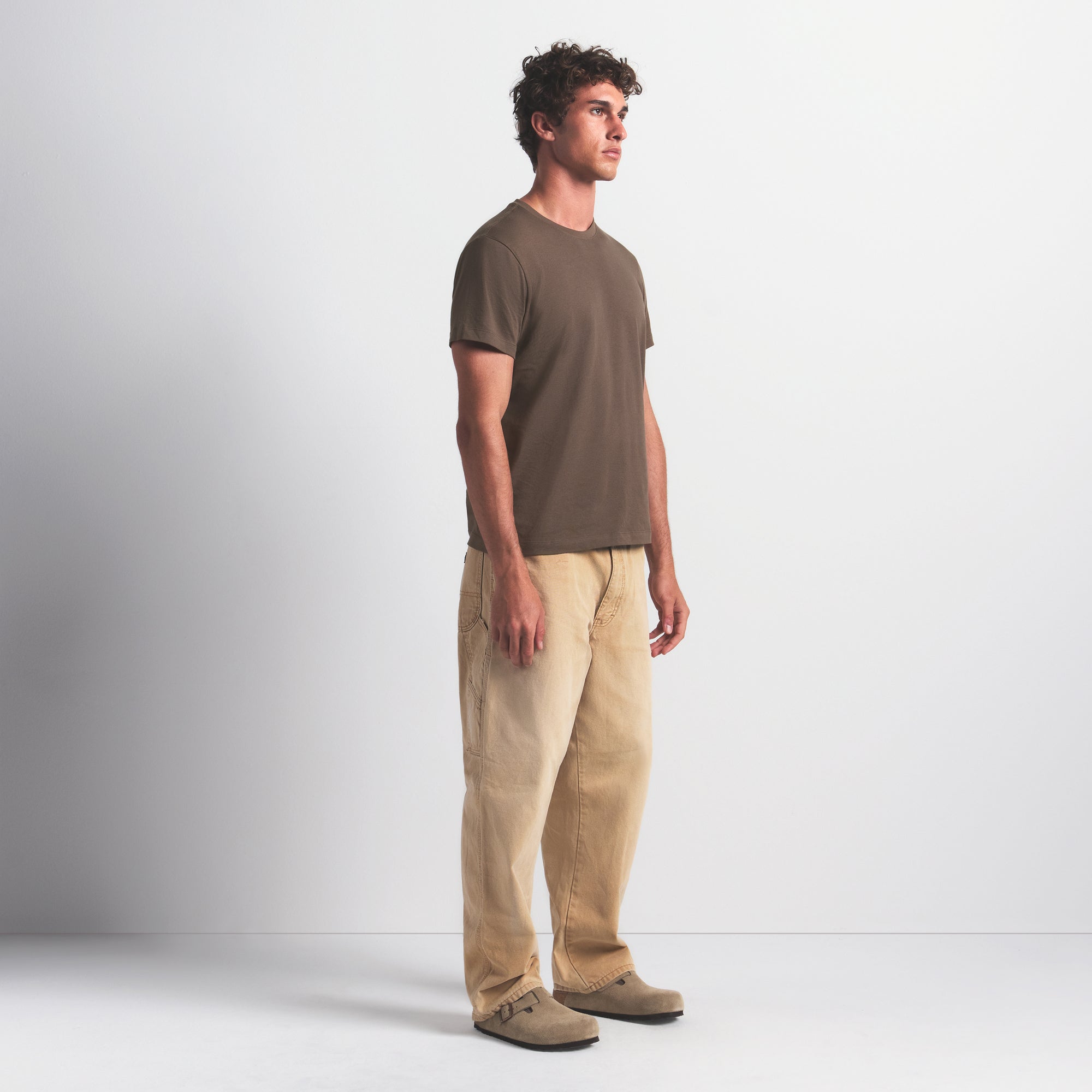 SKIMS COTTON MENS CLASSIC T-SHIRT | DRIFTWOOD ON A MODEL FRONT VIEW @ | FOCUS: 0.0, 1.0, 0.9