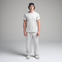 SKIMS COTTON MENS CLASSIC T-SHIRT | LIGHT HEATHER GREY ON A MODEL FRONT VIEW | FOCUS: 0.0, 1.0, 0.9