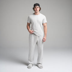 SKIMS COTTON MENS CLASSIC T-SHIRT | LIGHT HEATHER GREY ON A MODEL FRONT VIEW | FOCUS: 0.0, 1.0, 0.9