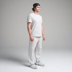 SKIMS COTTON MENS CLASSIC T-SHIRT | LIGHT HEATHER GREY ON A MODEL SIDE VIEW | FOCUS: 0.0, 1.0, 0.9