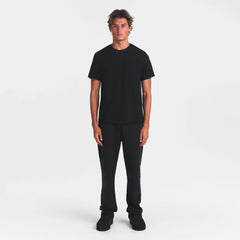 SKIMS COTTON MENS CLASSIC T-SHIRT | ONYX ON A MODEL FRONT VIEW @ | FOCUS: 0.0, 1.0, 0.9