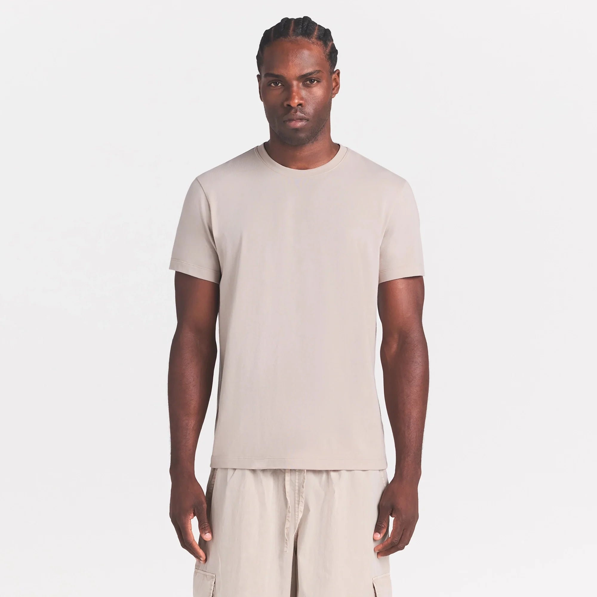SKIMS COTTON MENS CLASSIC T-SHIRT | STONE ON A MODEL SIDE VIEW @ | FOCUS: 0.0, 1.0, 0.9