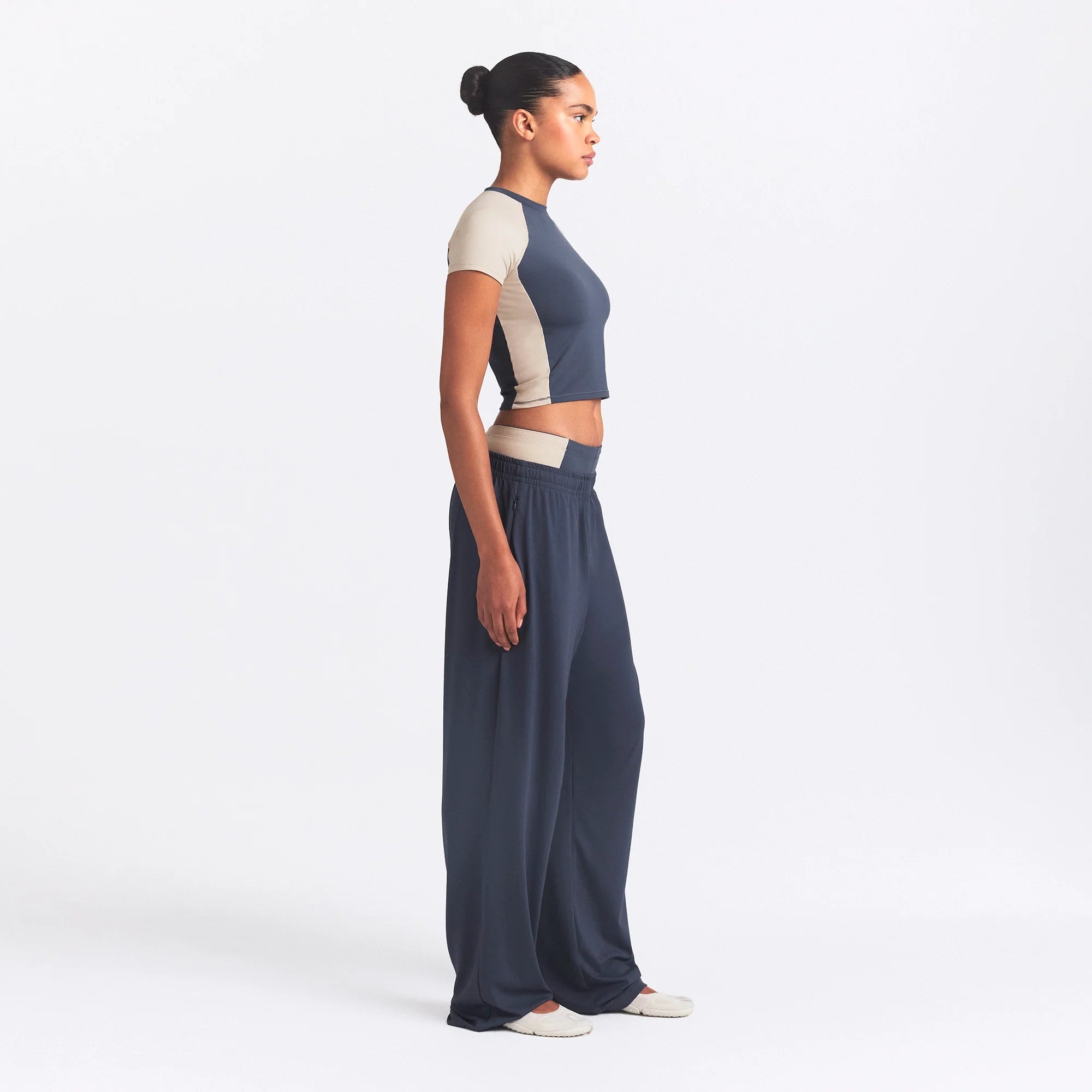 NikeSKIMS MATTE AND SHINE CREWNECK CROP SHORT SLEEVE | DEEP ROYAL/STONE ON A MODEL SIDE VIEW @ | FOCUS: 0.0, 1.0, 0.9