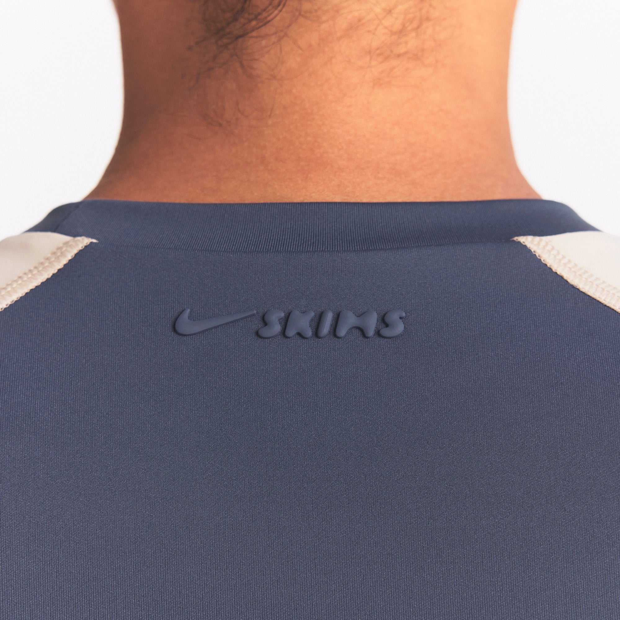 NikeSKIMS MATTE AND SHINE CREWNECK CROP SHORT SLEEVE | DEEP ROYAL/STONE ON A MODEL SIDE VIEW @ | FOCUS: 0.0, 1.0, 0.9