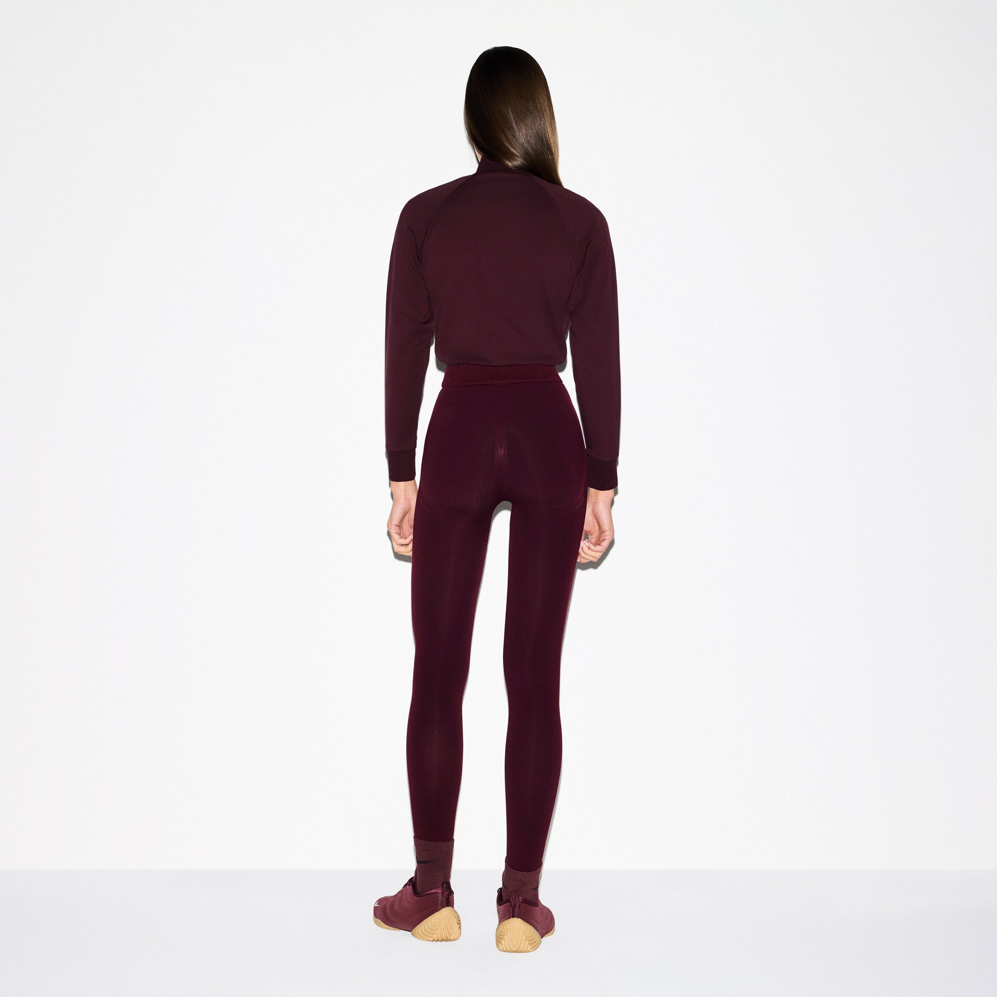 NikeSKIMS MATTE TRICOT TRACK JACKET | CURRANT ON A MODEL SIDE VIEW @ | FOCUS: 0.0, 1.0, 0.9