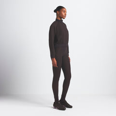 NikeSKIMS MATTE TRICOT TRACK JACKET | DARK ROAST ON A MODEL SIDE VIEW @ | FOCUS: 0.0, 1.0, 0.9