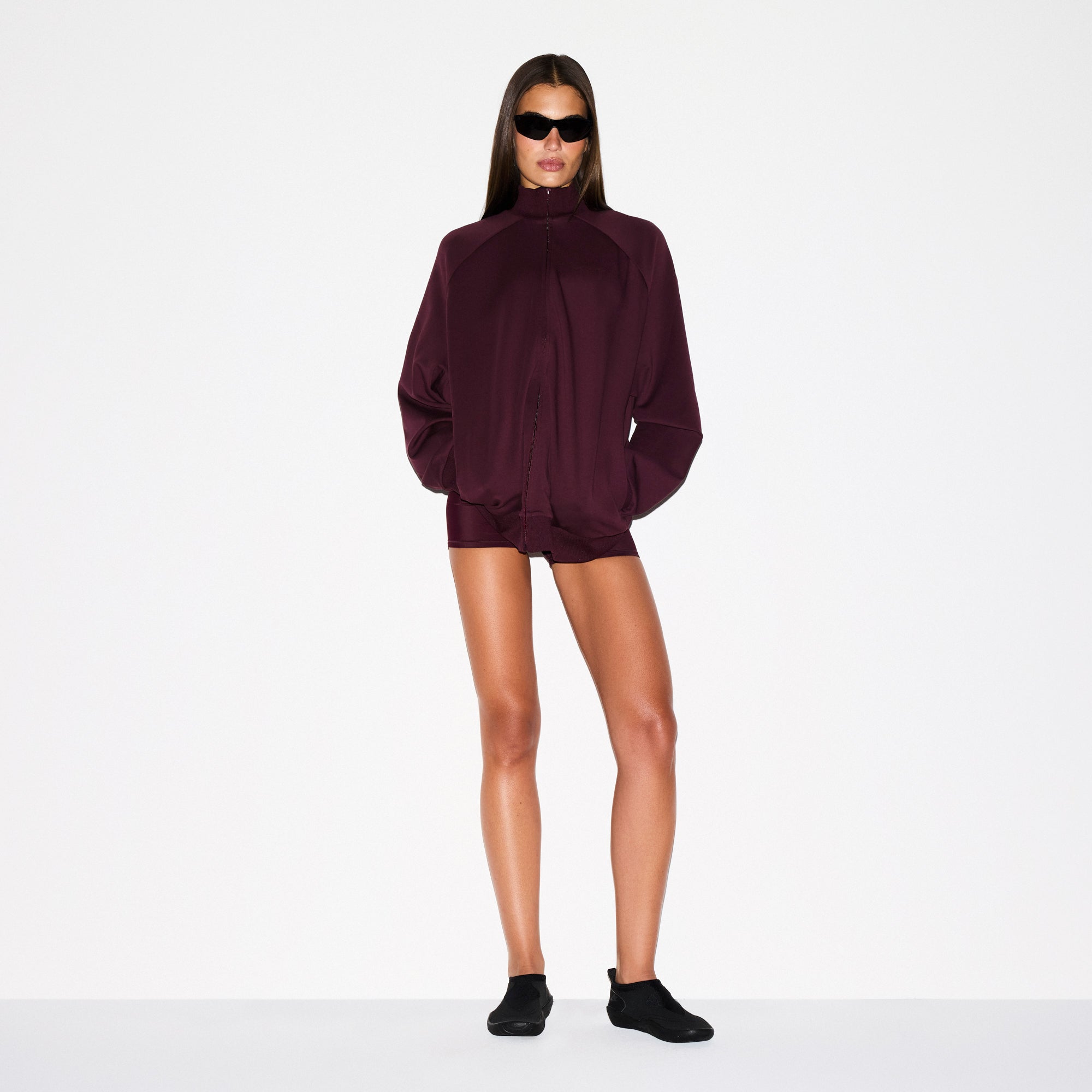NikeSKIMS MATTE TRICOT OVERSIZED TRACK JACKET | CURRANT ON A MODEL FRONT VIEW @ | FOCUS: 0.0, 1.0, 0.9