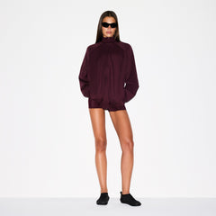 NikeSKIMS MATTE TRICOT OVERSIZED TRACK JACKET | CURRANT ON A MODEL FRONT VIEW @ | FOCUS: 0.0, 1.0, 0.9