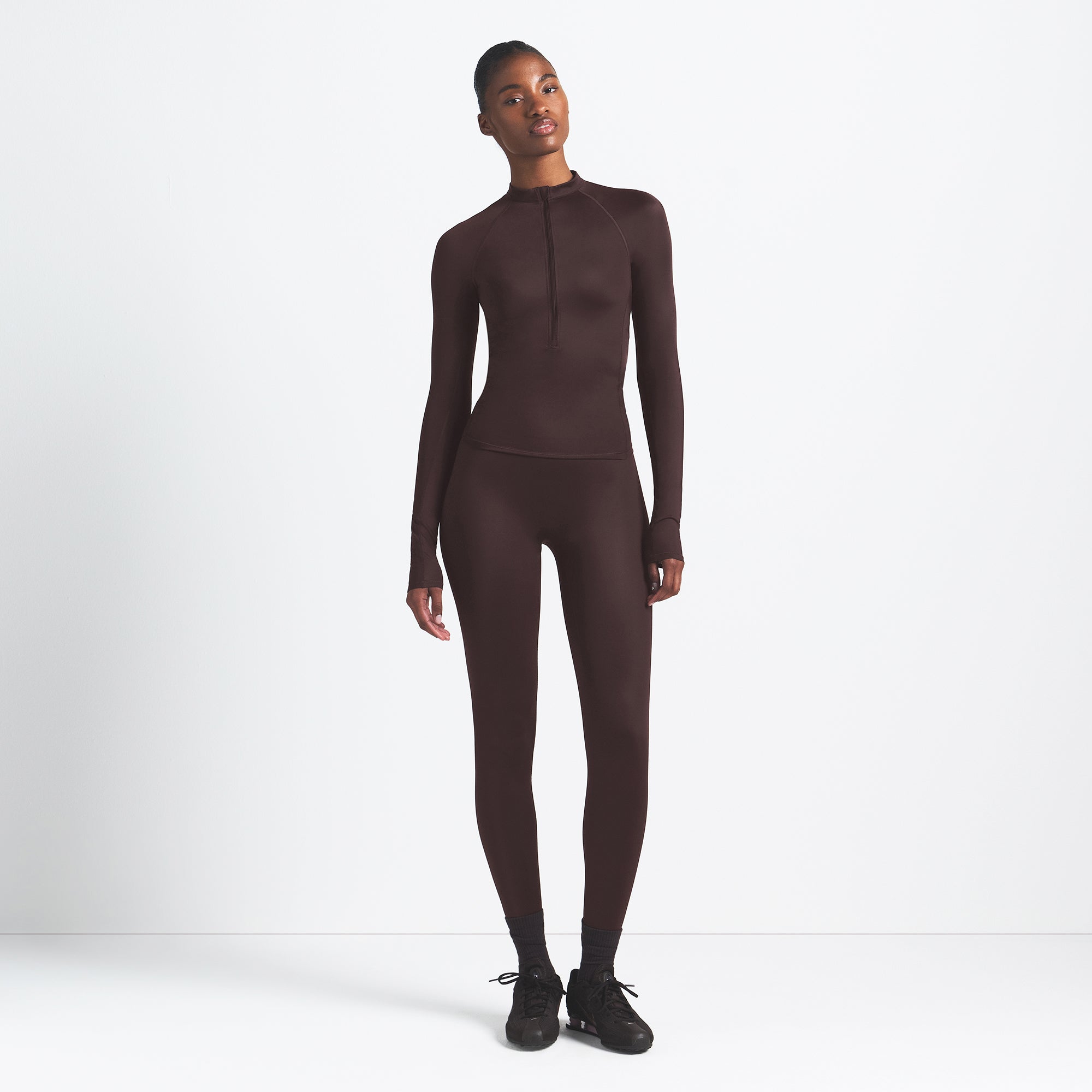 NikeSKIMS SHINE LONG SLEEVE HALF ZIP | PHOENIX ON A MODEL FRONT VIEW @ | FOCUS: 0.9, 0.1, 0.7