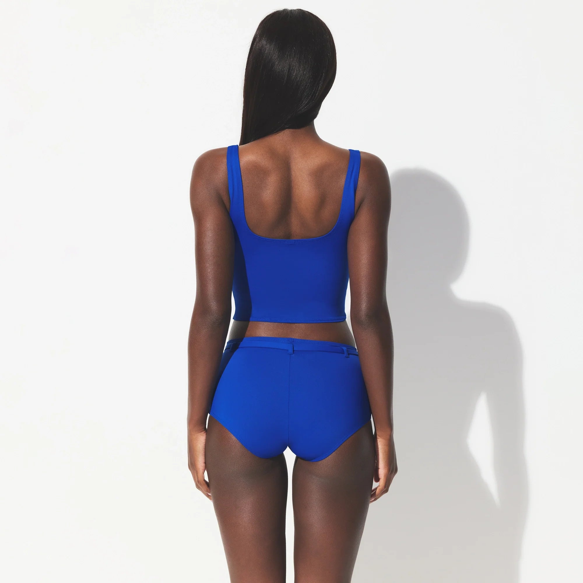 ICONIC SWIM CROP TOP | COBALT ON A MODEL SIDE VIEW @ | FOCUS: 0.0, 1.0, 0.9 