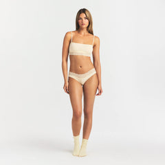 LIGHTWEIGHT COTTON WIDE LACE BRIEF | BUTTER TONAL ON A MODEL FRONT VIEW @ | FOCUS: 0.0, 1.0, 0.9