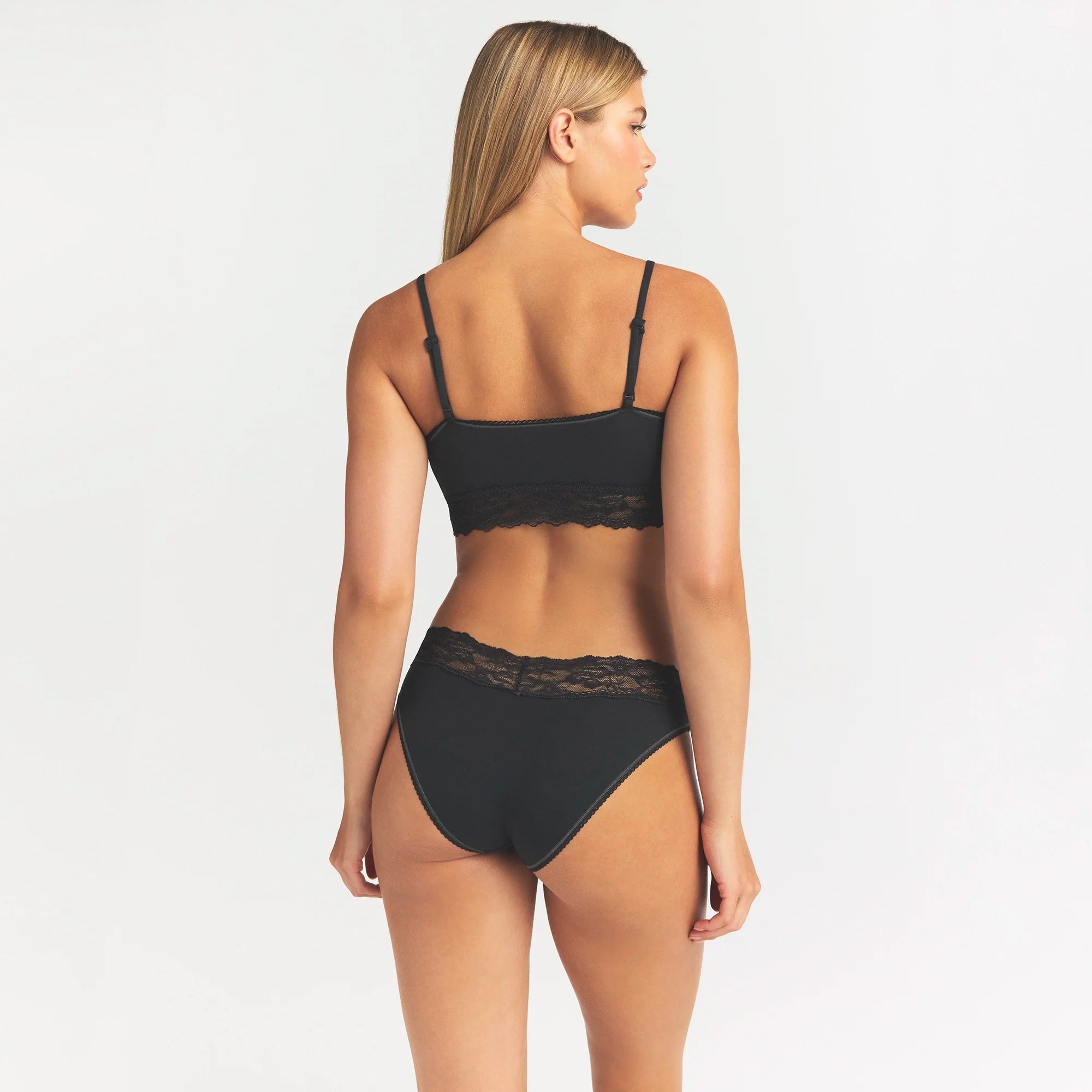 LIGHTWEIGHT COTTON WIDE LACE BRIEF | SOOT TONAL ON A MODEL SIDE VIEW @ | FOCUS: 0.0, 1.0, 0.9