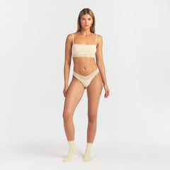 LIGHTWEIGHT COTTON WIDE LACE THONG | BUTTER TONAL ON A MODEL FRONT VIEW @ | FOCUS: 0.0, 1.0, 0.9