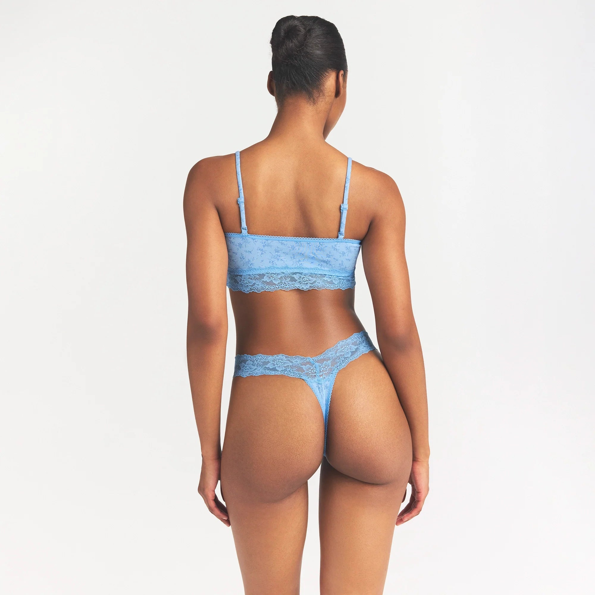 LIGHTWEIGHT COTTON WIDE LACE THONG | SURF DAINTY FLORAL PRINT ON A MODEL SIDE VIEW @ | FOCUS: 0.0, 1.0, 0.9
