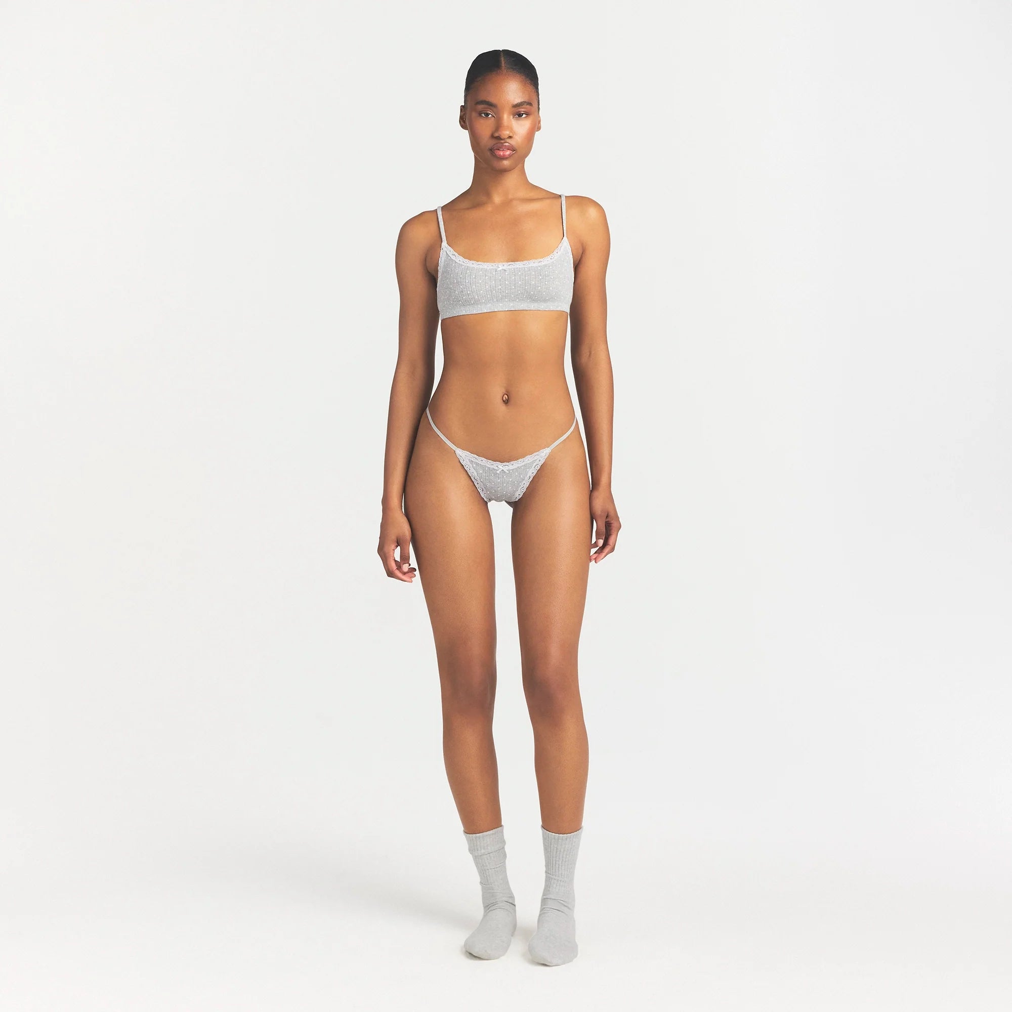 LIGHTWEIGHT COTTON POINTELLE LACE STRING THONG | LIGHT HEATHER GREY PIN DOT ON A MODEL FRONT VIEW @ | FOCUS: 0.0, 1.0, 0.9