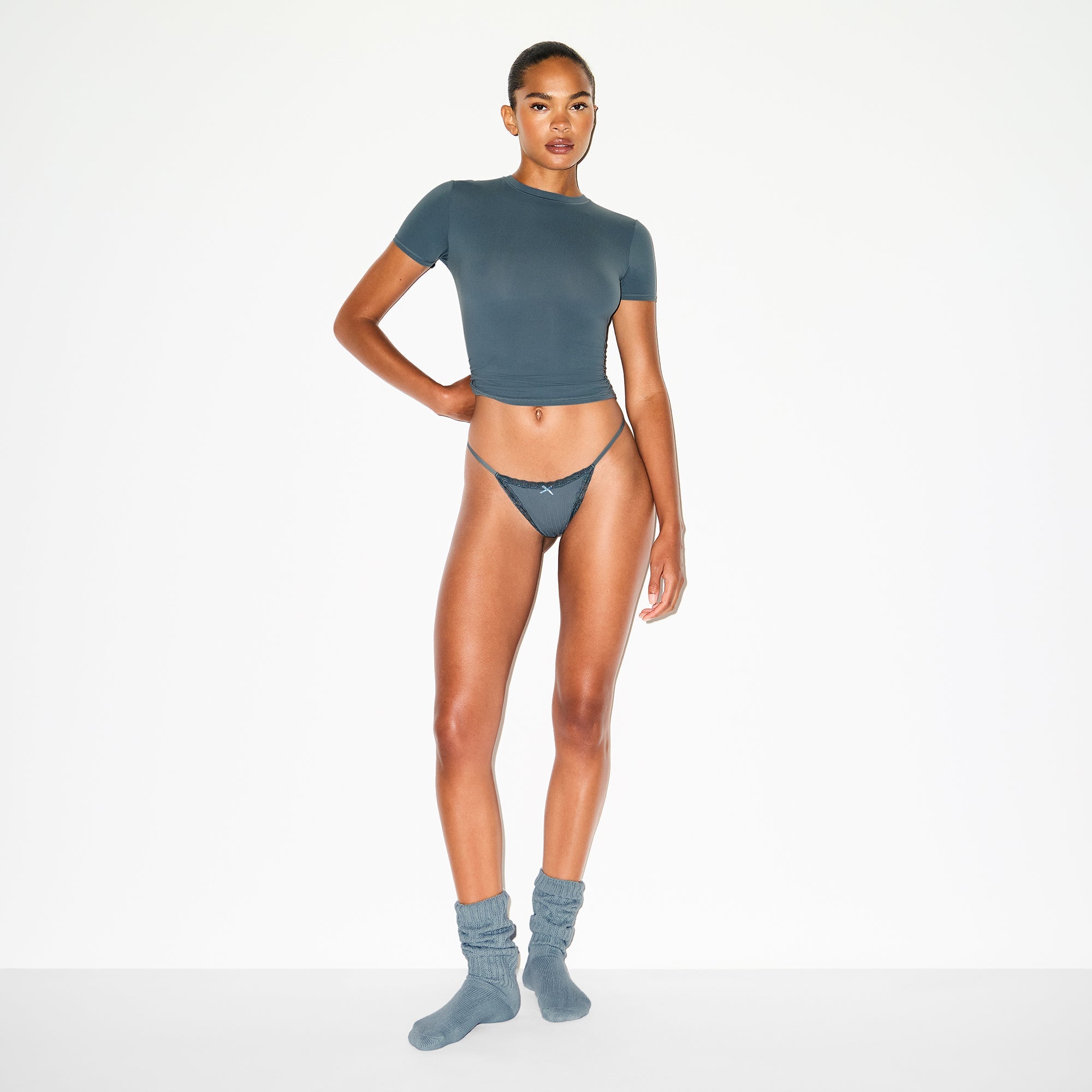 LIGHTWEIGHT COTTON POINTELLE LACE STRING THONG | ZIRCON TONAL ON A MODEL FRONT VIEW @ | FOCUS: 0.0, 1.0, 0.9