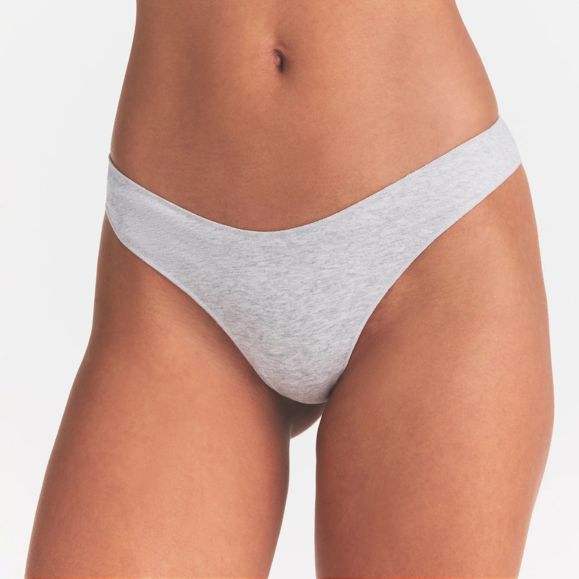 LIGHTWEIGHT COTTON THONG 10-PACK | MICRO DOT FLORAL MULTI ON A MODEL SIDE VIEW @ | FOCUS: 0.0, 1.0, 0.9