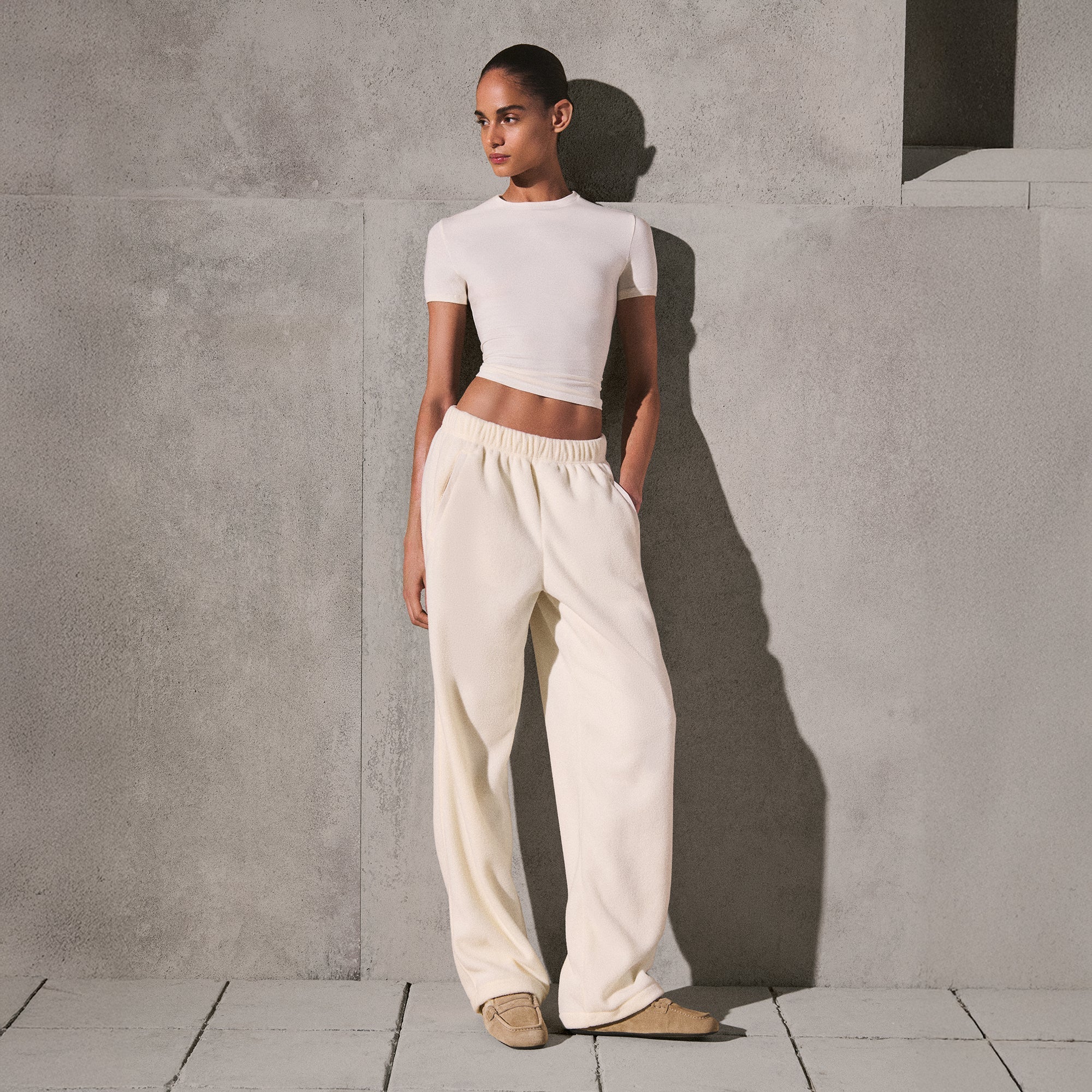 OUTDOOR FLEECE STRAIGHT LEG PANT | ECRU ON A MODEL SIDE VIEW @ | FOCUS: 0.0, 1.0, 0.9
