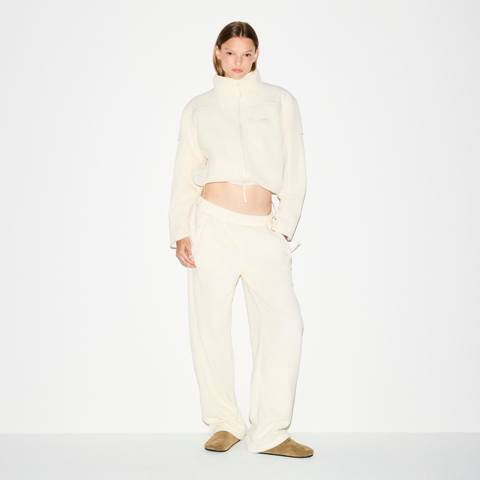 OUTDOOR FLEECE STRAIGHT LEG PANT | ECRU ON A MODEL FRONT VIEW @ | FOCUS: 0.0, 1.0, 0.9