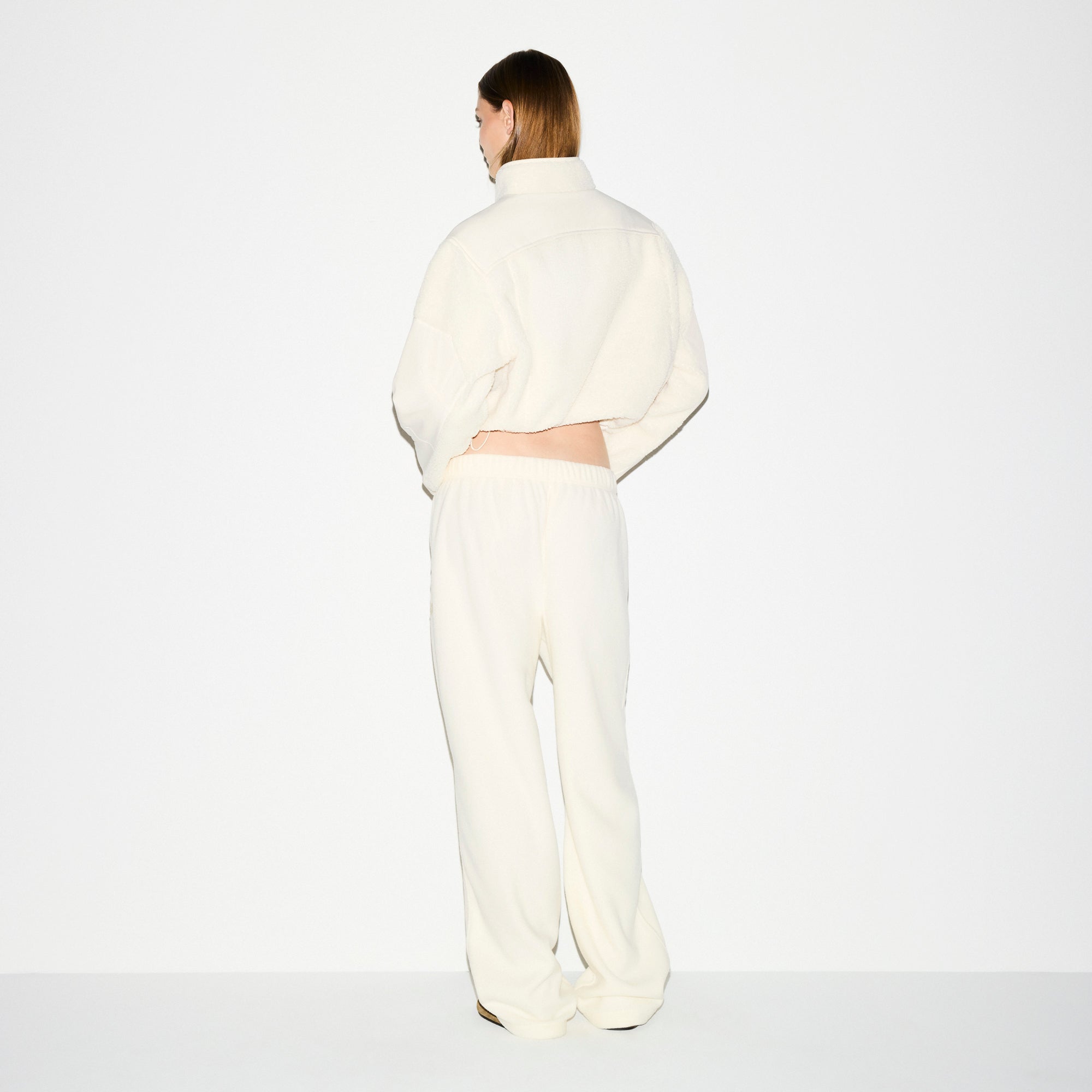OUTDOOR FLEECE STRAIGHT LEG PANT | ECRU ON A MODEL SIDE VIEW @ | FOCUS: 0.0, 1.0, 0.9